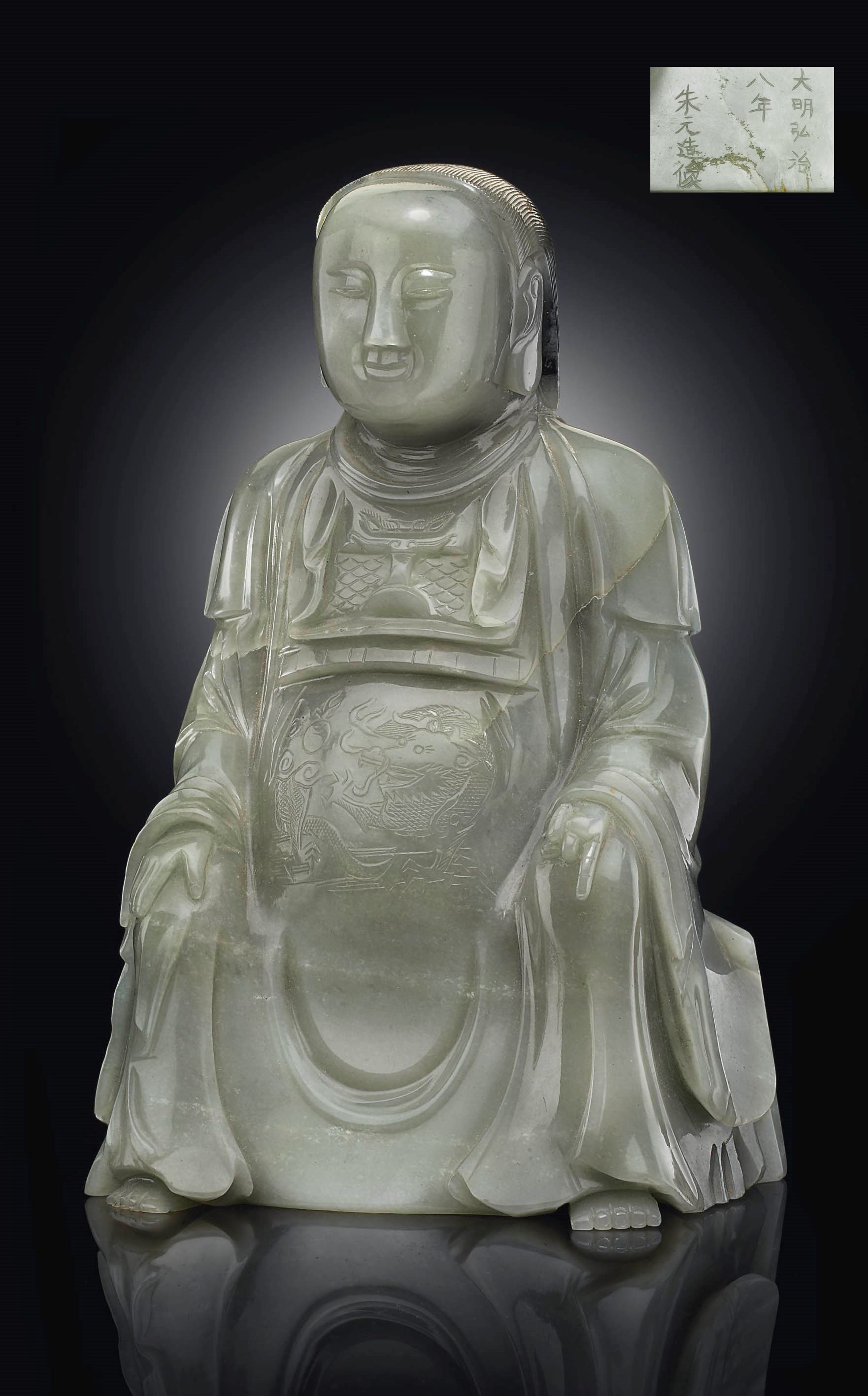 AN UNUSUAL DATED GREY JADE FIGURE OF ZHENWU