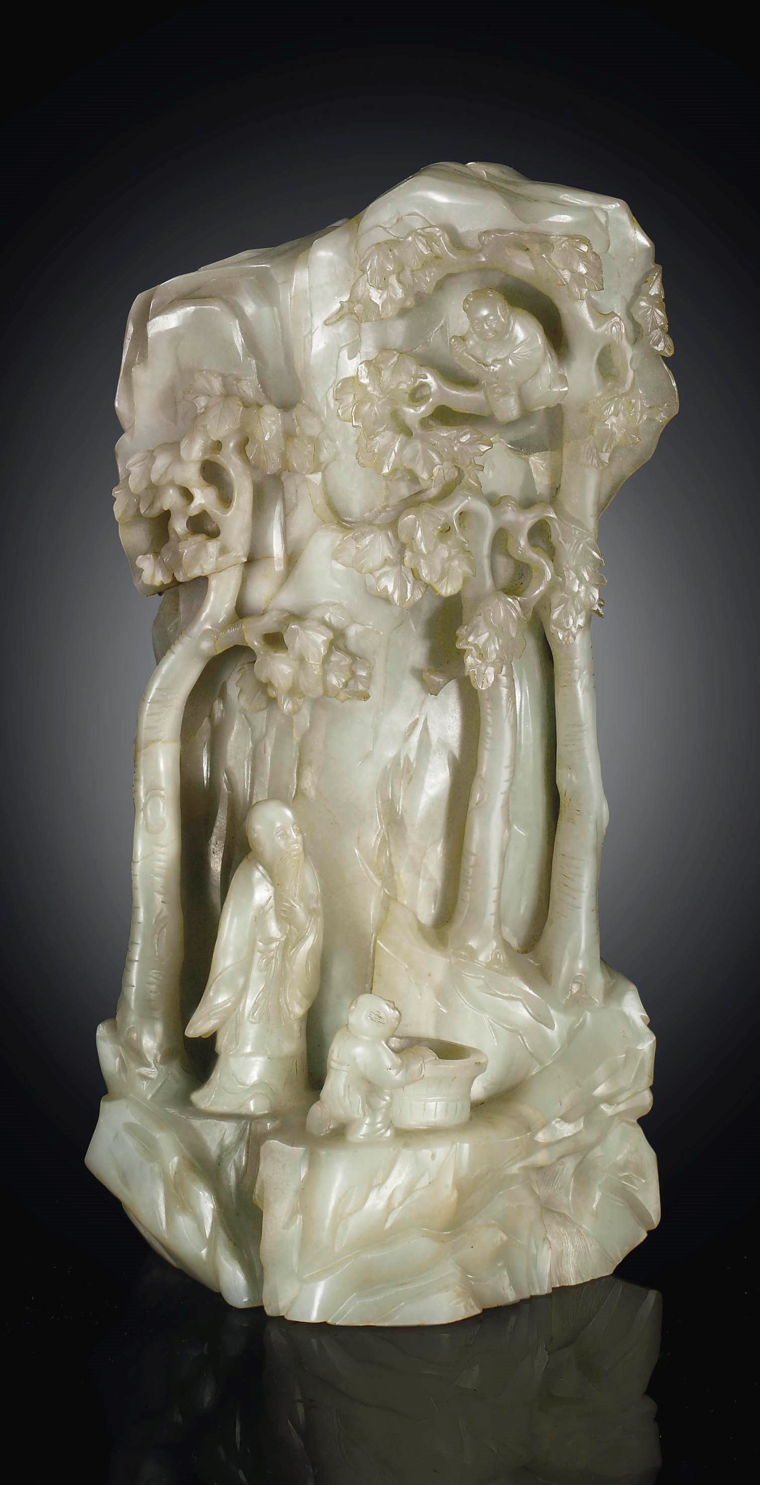 A PALE GREENISH-WHITE JADE MOUNTAIN