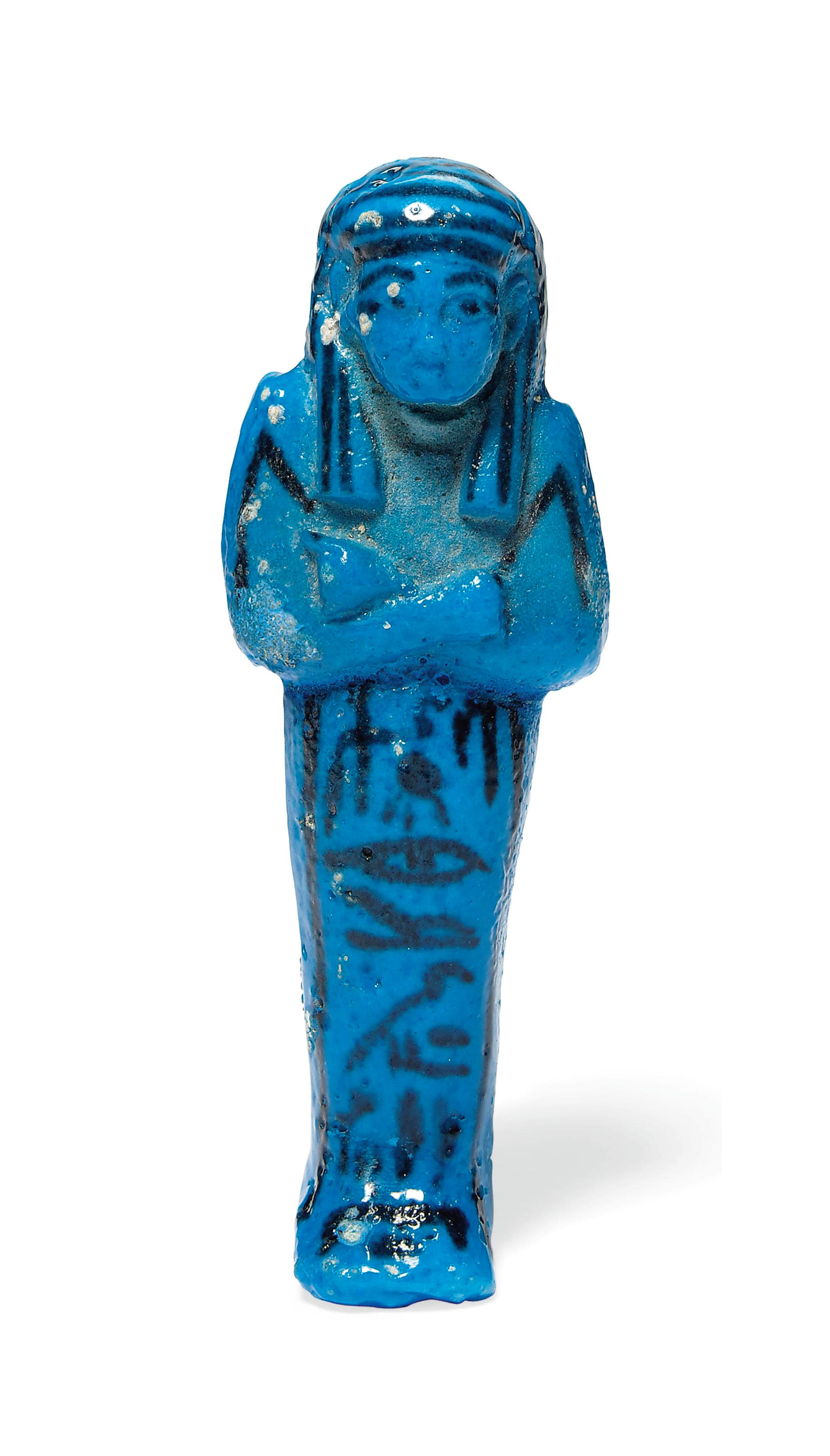 AN EGYPTIAN BRIGHT BLUE FAIENCE SHABTI FOR TAYUHERET