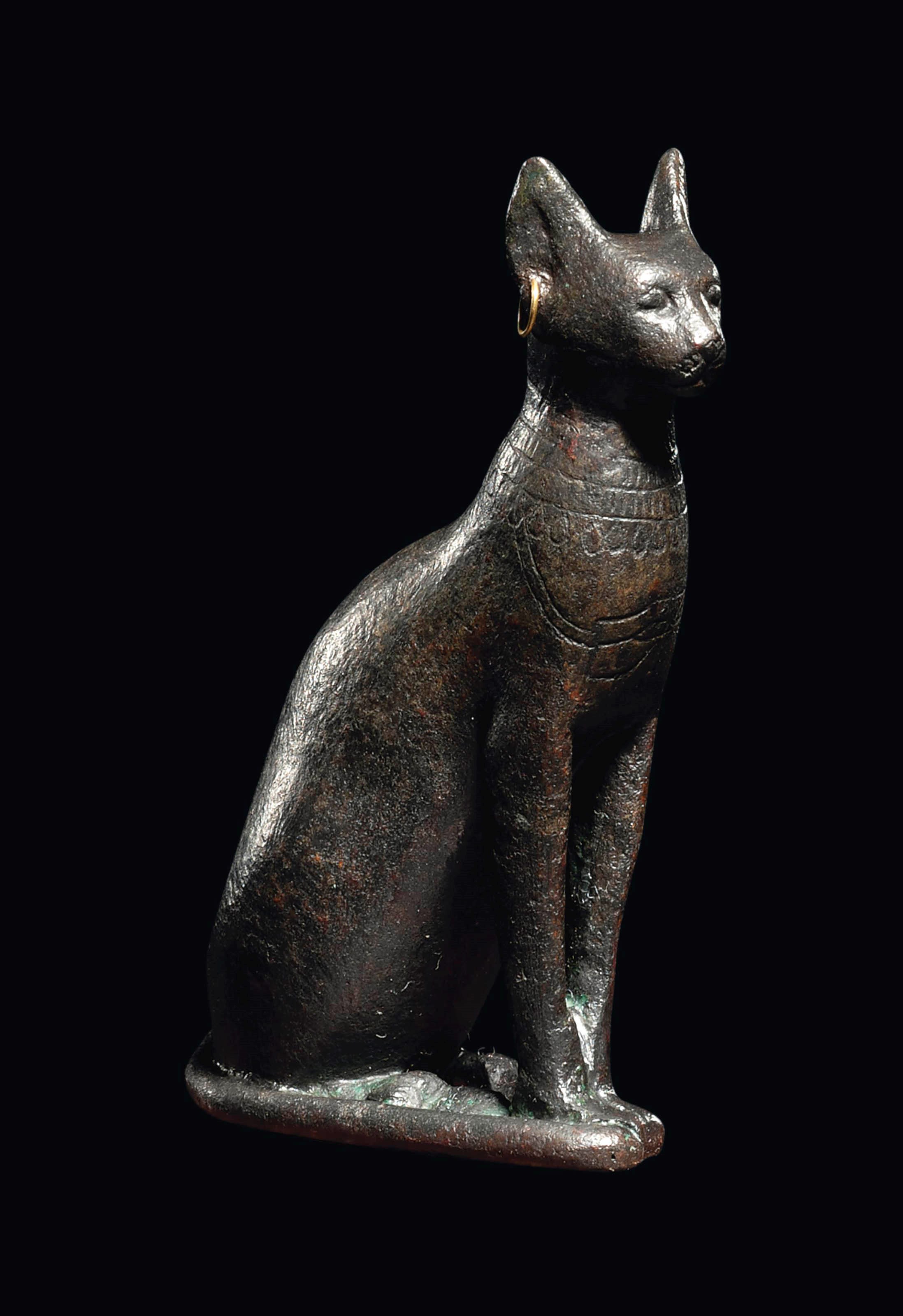 AN EGYPTIAN BRONZE CAT