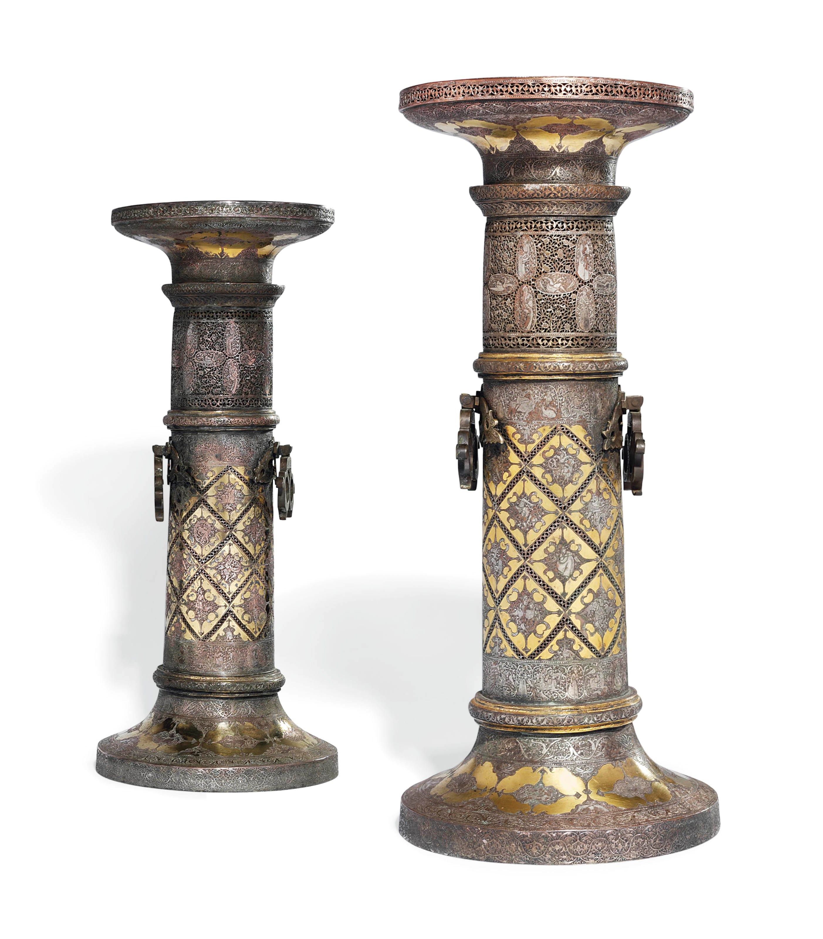 AN IMPRESSIVE PAIR OF QAJAR CANDLESTICKS (SHAMDAN)