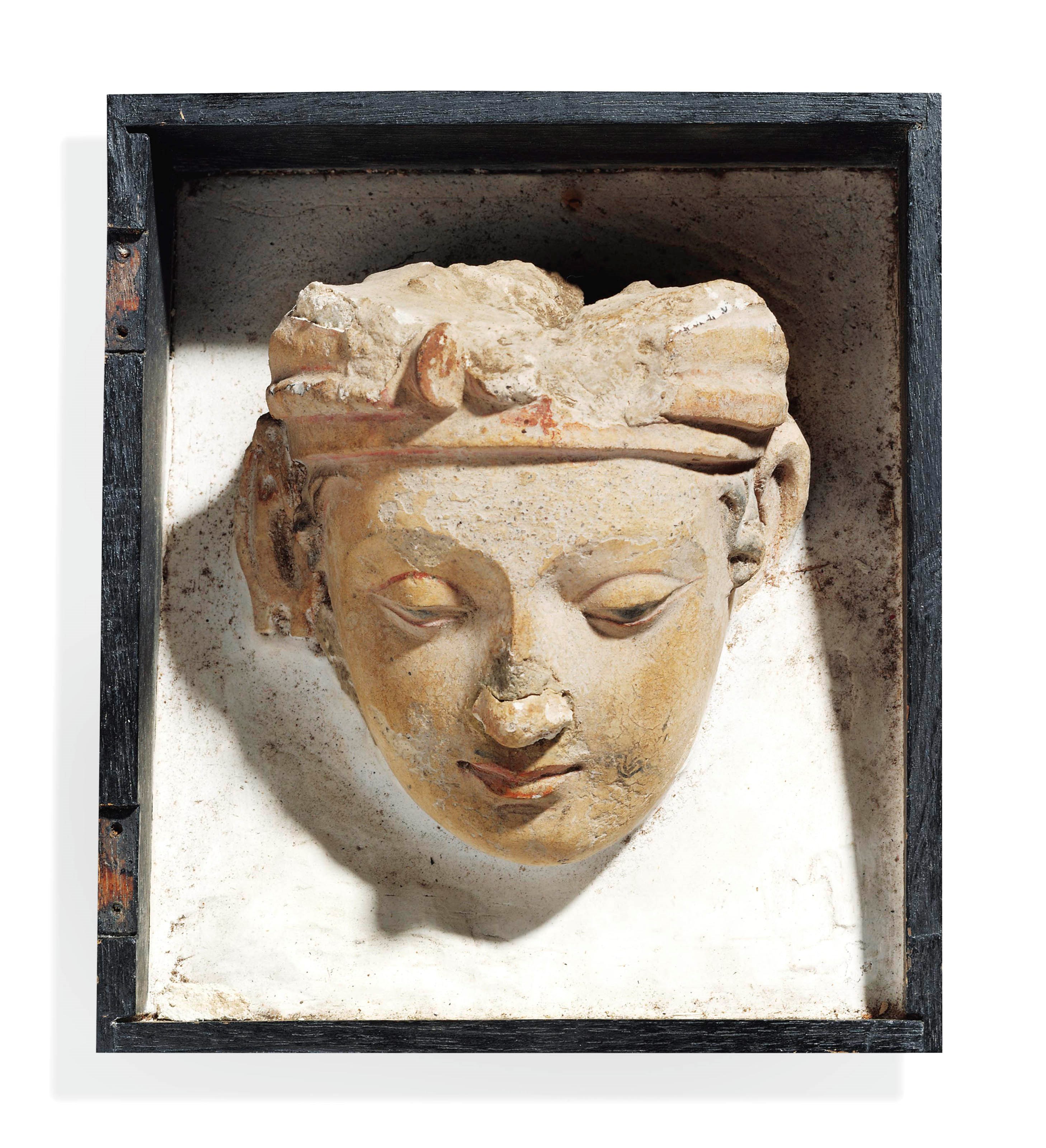 A STUCCO HEAD OF A BODHISATTVA