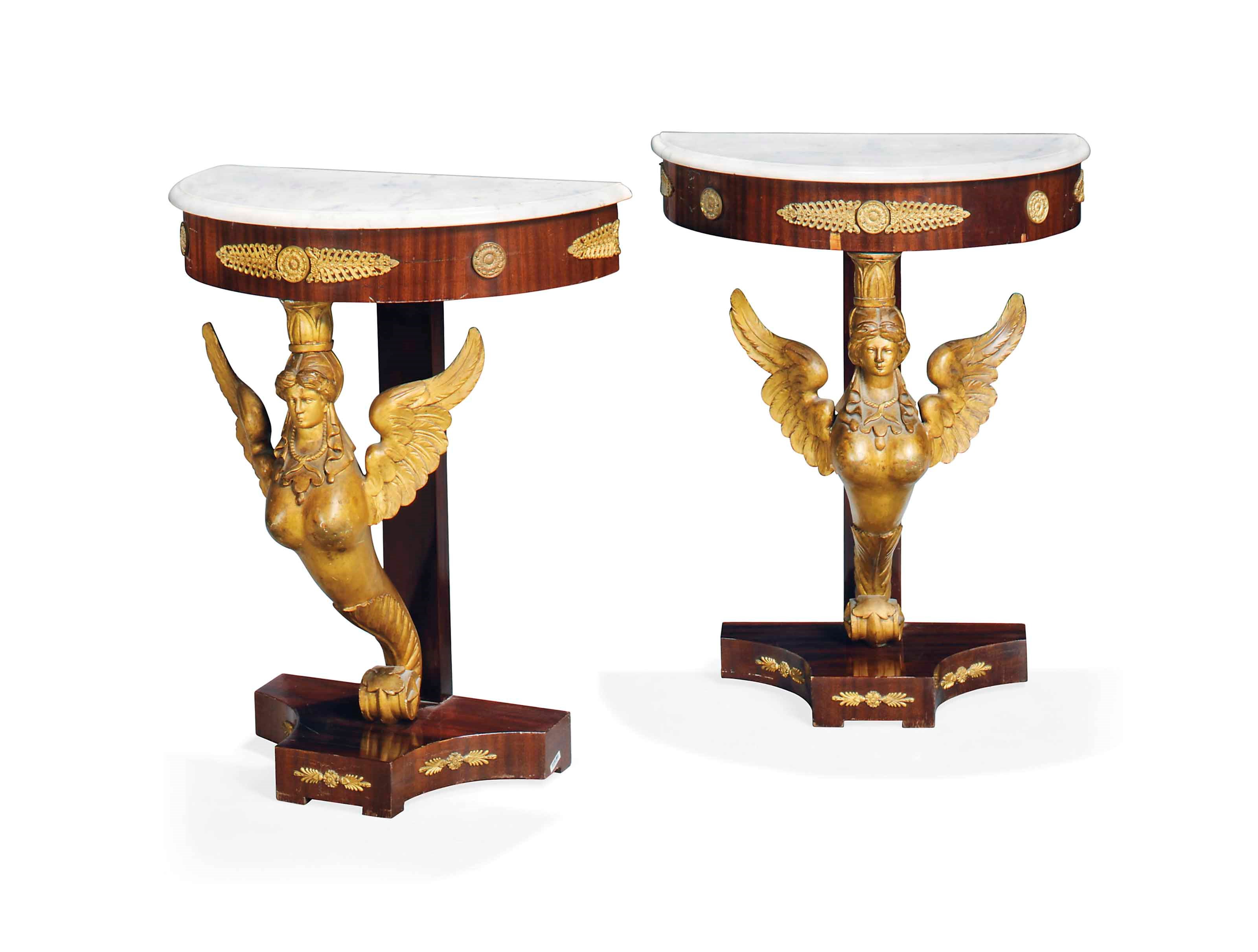 A PAIR OF MAHOGANY AND PARCEL GILT DEMI-LUNE CONSOLE TABLES