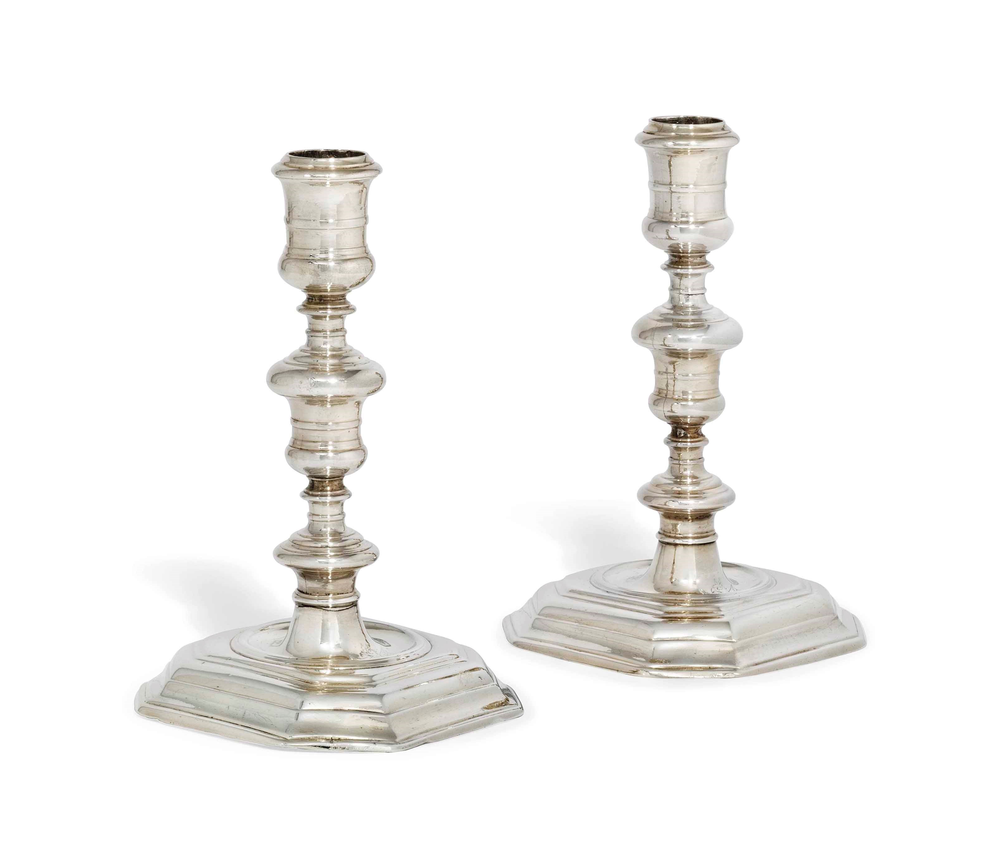 A PAIR OF QUEEN ANNE SILVER CANDLESTICKS