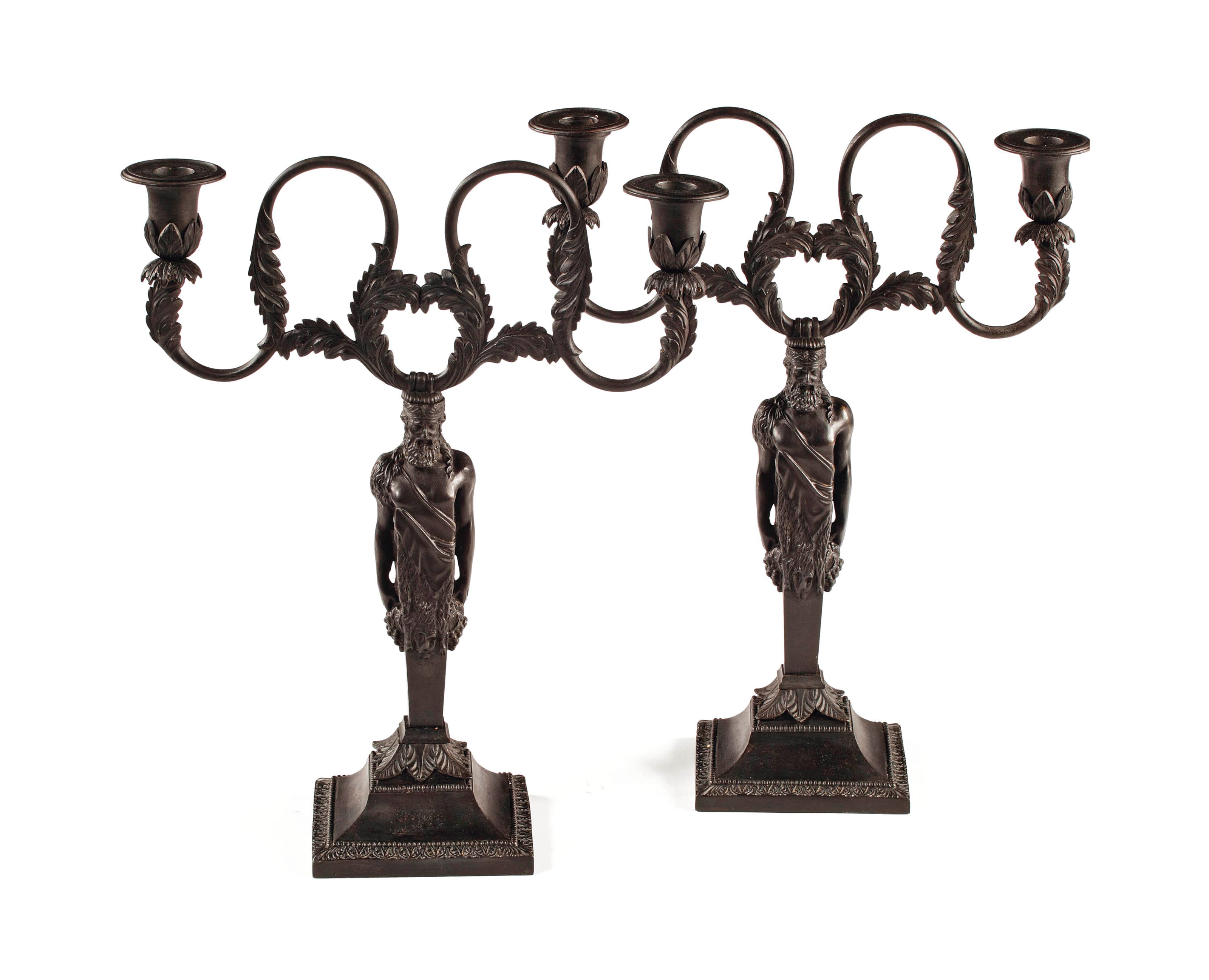 A pair of German cast-iron two-light figural candelabra