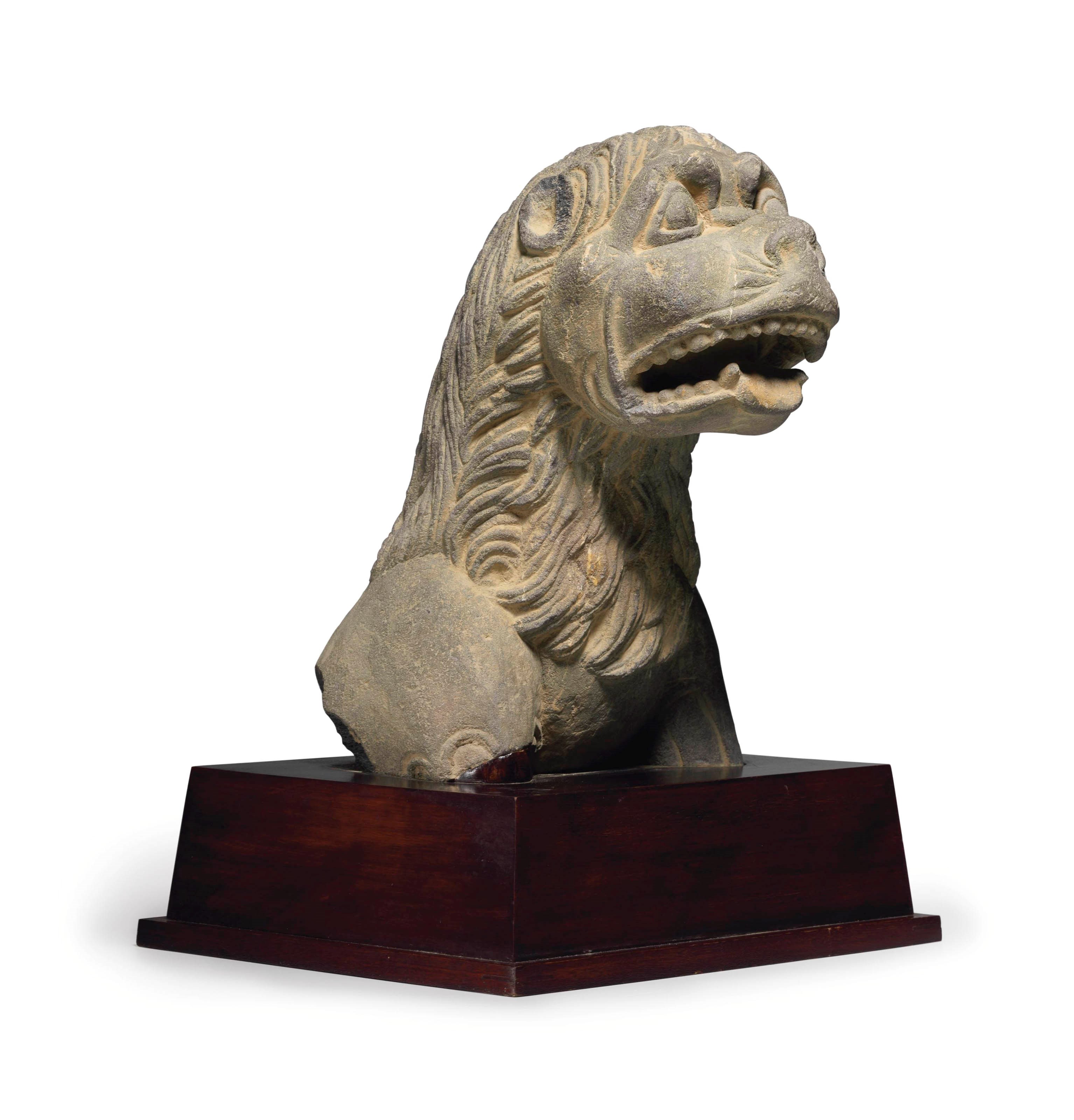 A gray schist figure of a lion