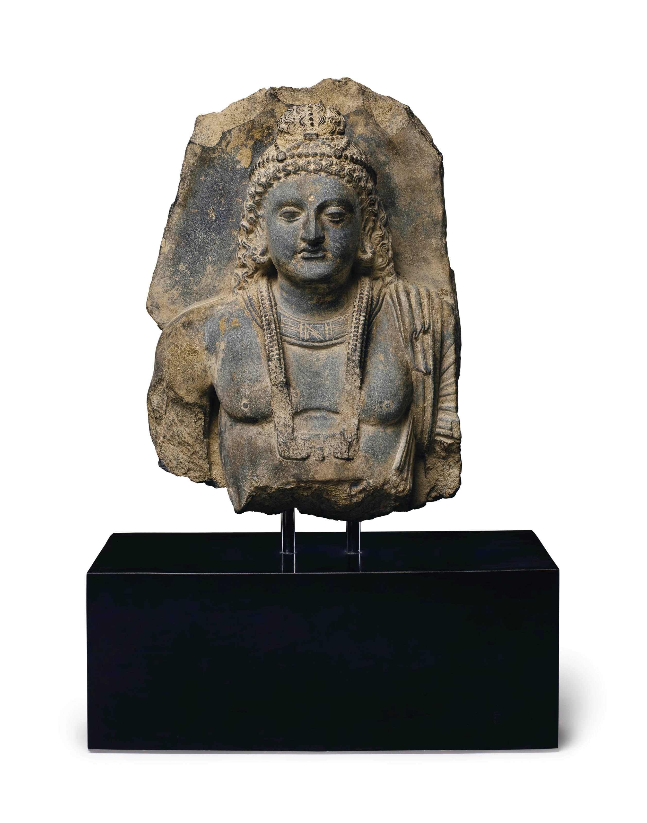 A gray schist bust of a bodhisattva