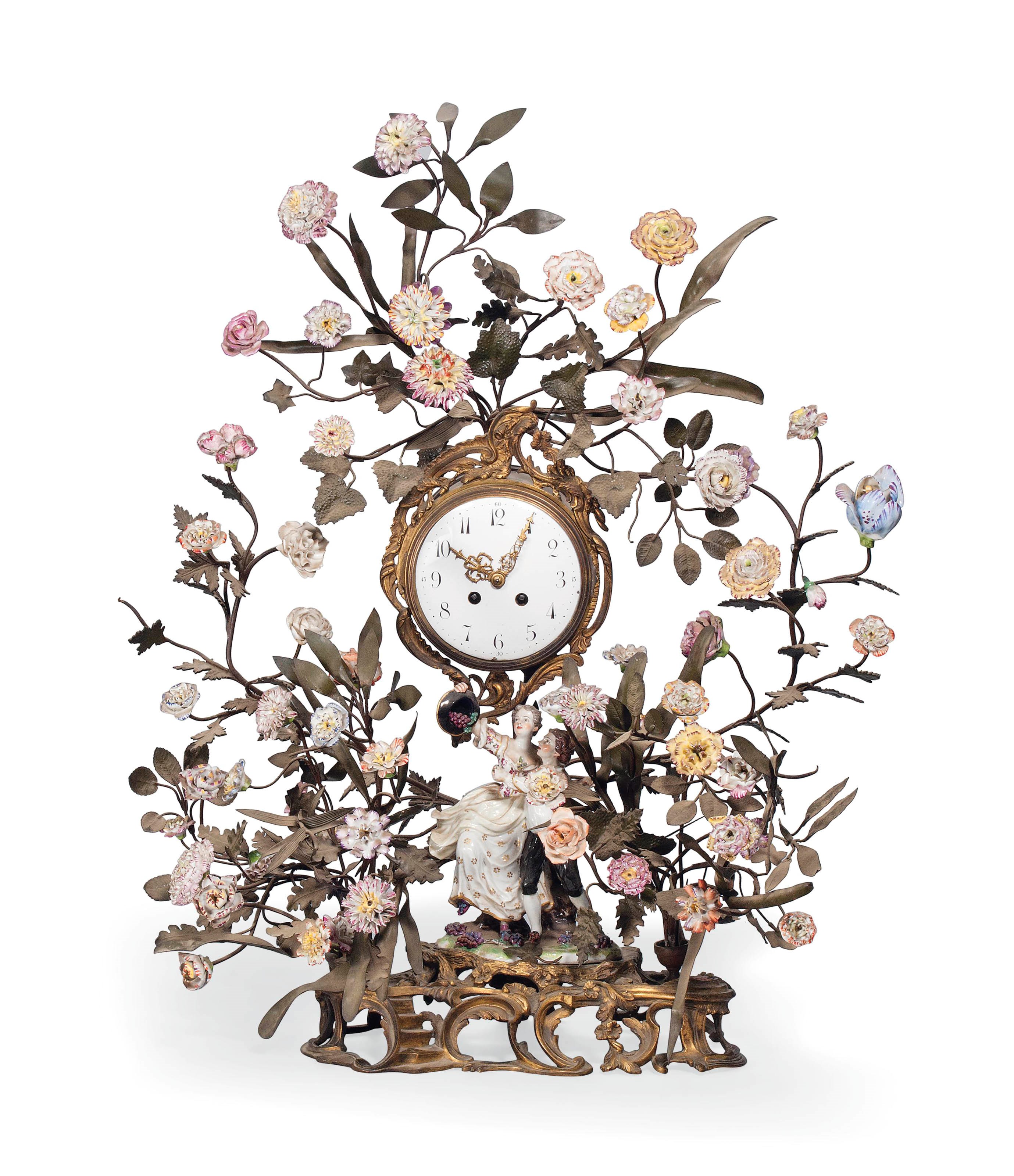 A GILT-METAL AND PORCELAIN-MOUNTED CLOCK