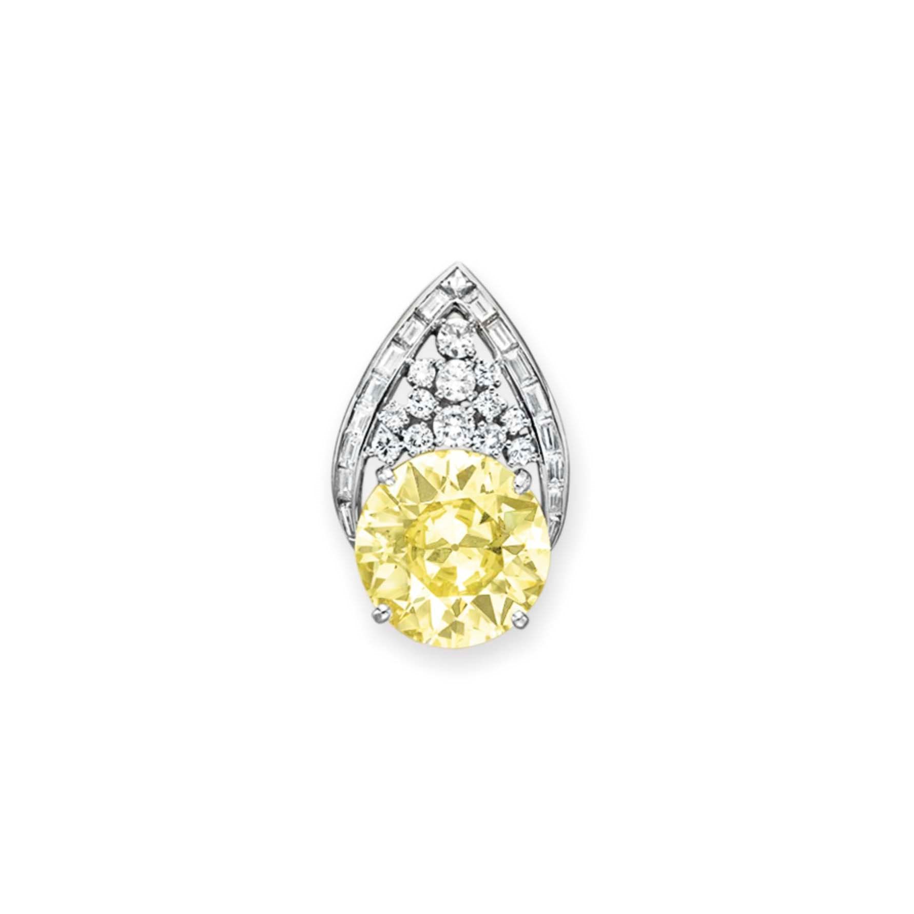 A COLORED DIAMOND AND DIAMOND PLAQUE