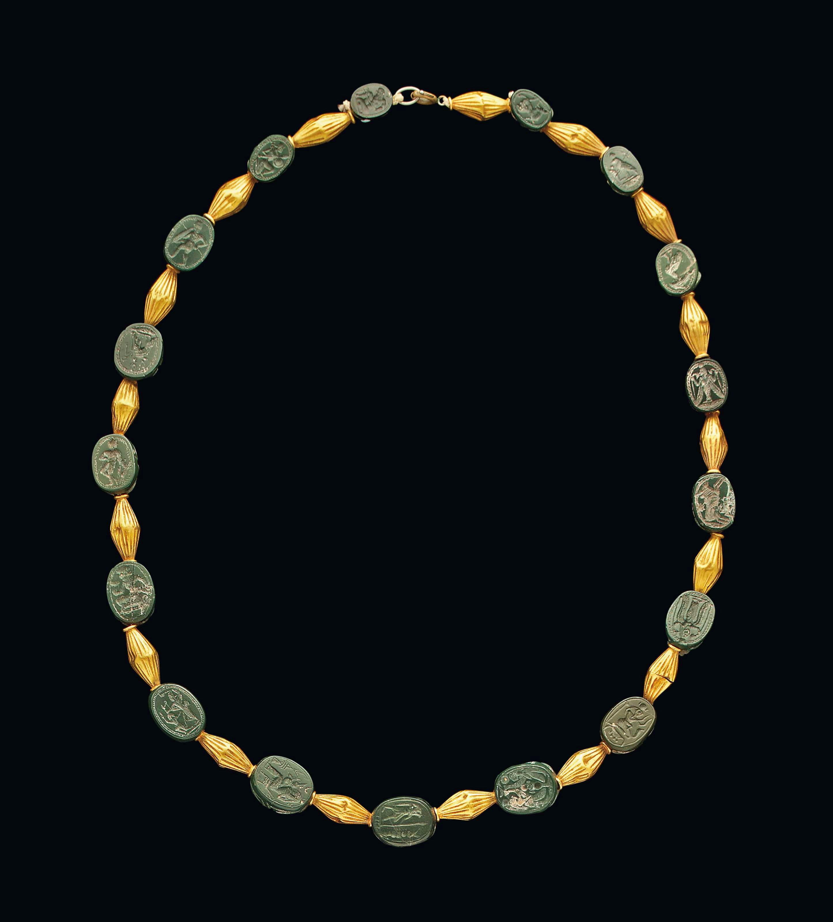 SEVENTEEN PHOENICIAN GREEN JASPER SCARABS