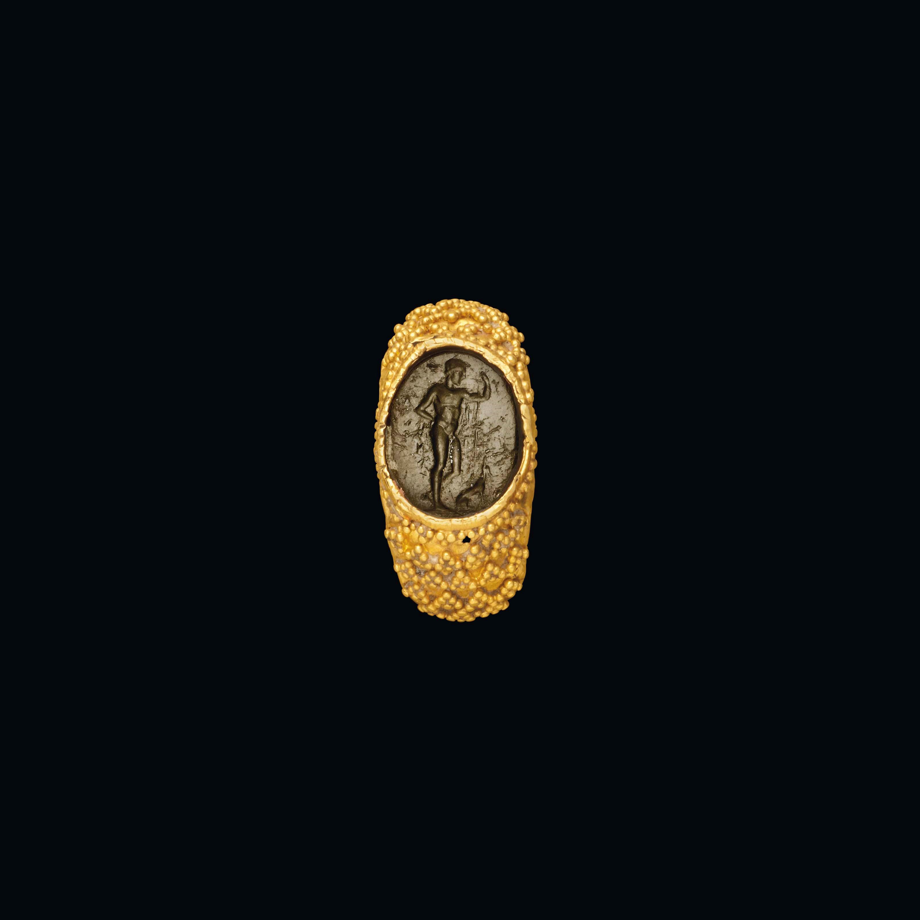 A ROMAN GOLD AND GLASS INTAGLIO RING