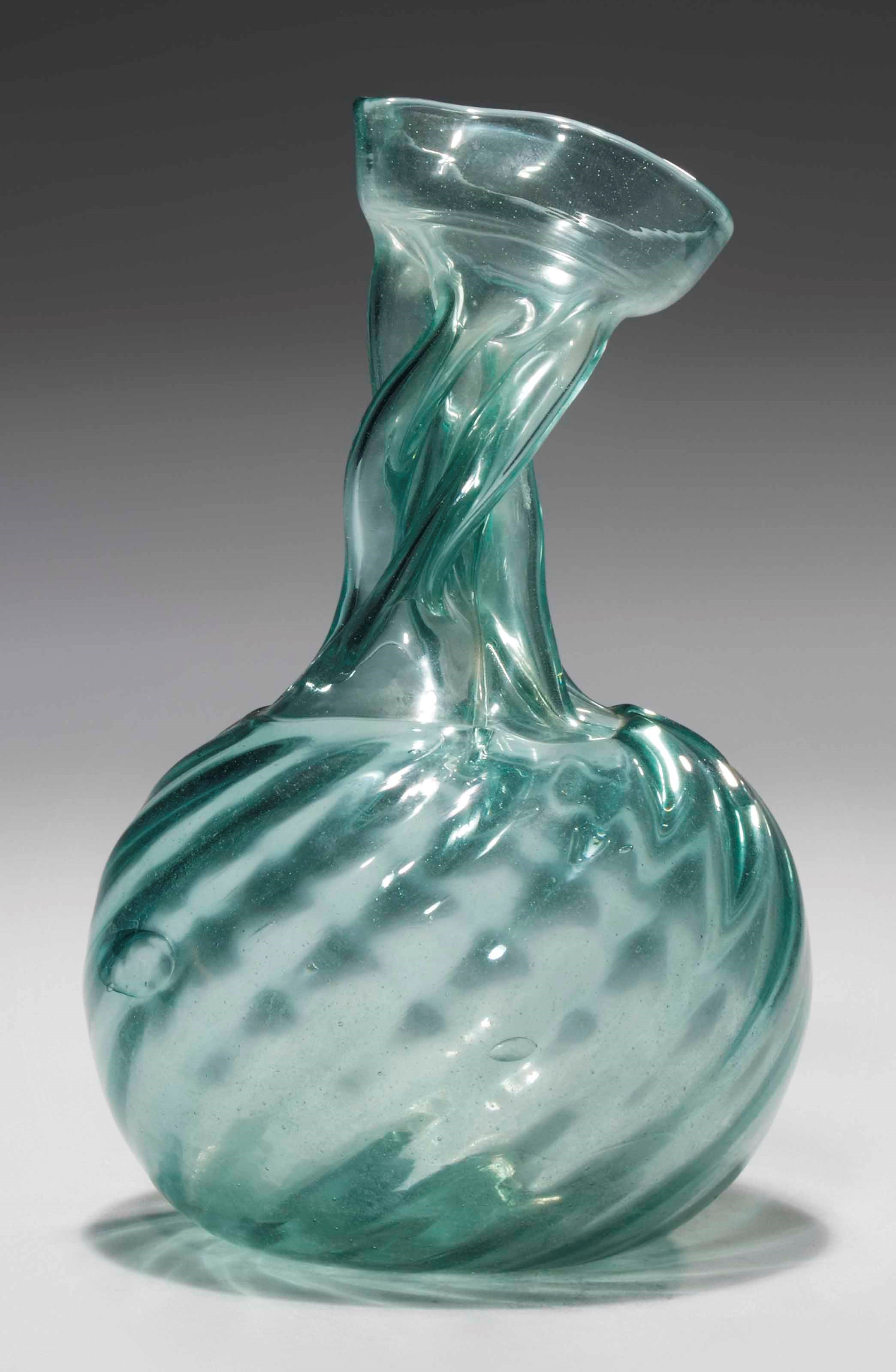 A PALE GREEN GLASS KUTTROLF