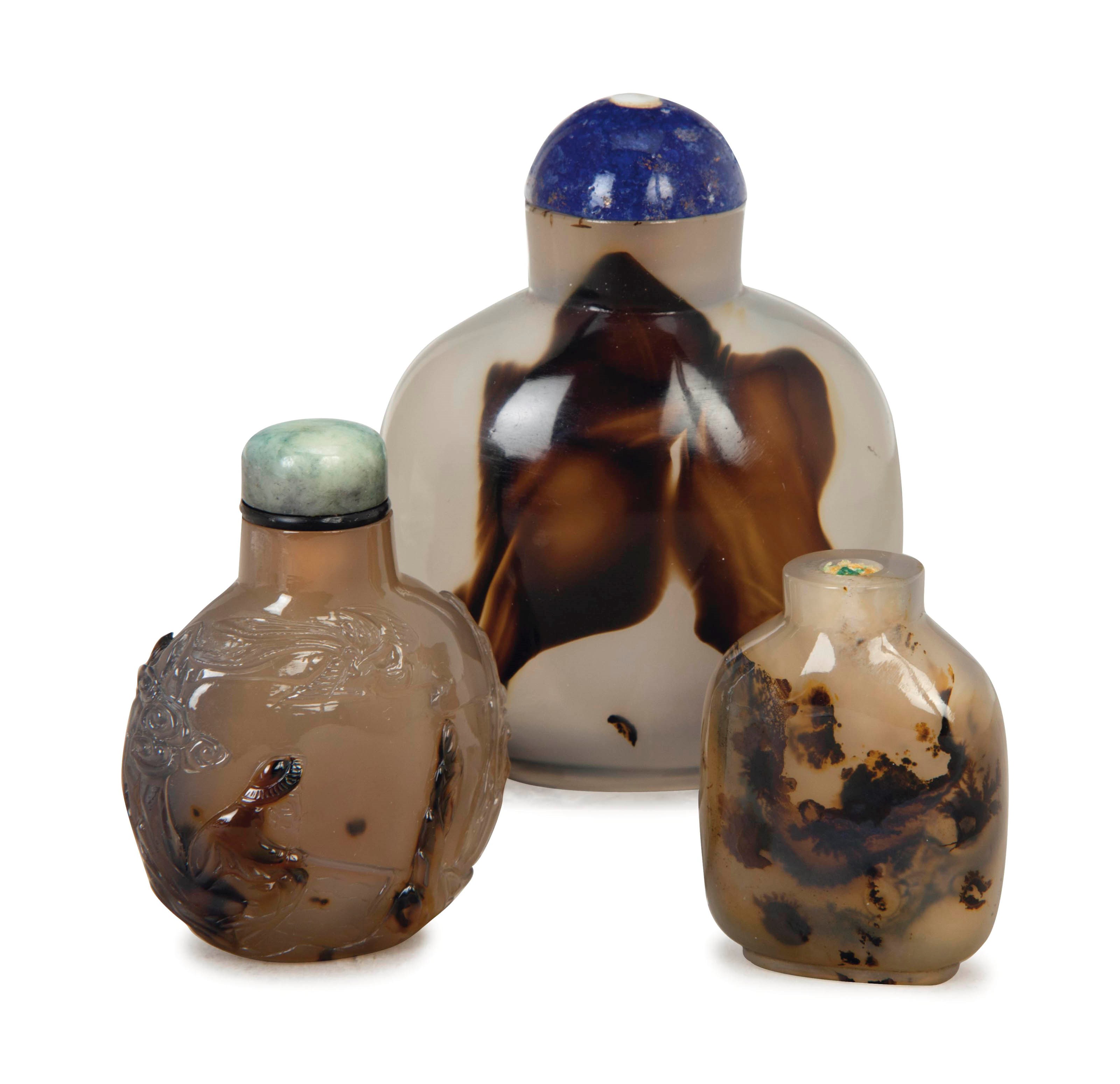 TWO CHINESE 'SHADOW' AGATE SNUFF BOTTLES, AND A 'SILHOUETTE' AGATE SNUFF BOTTLE,