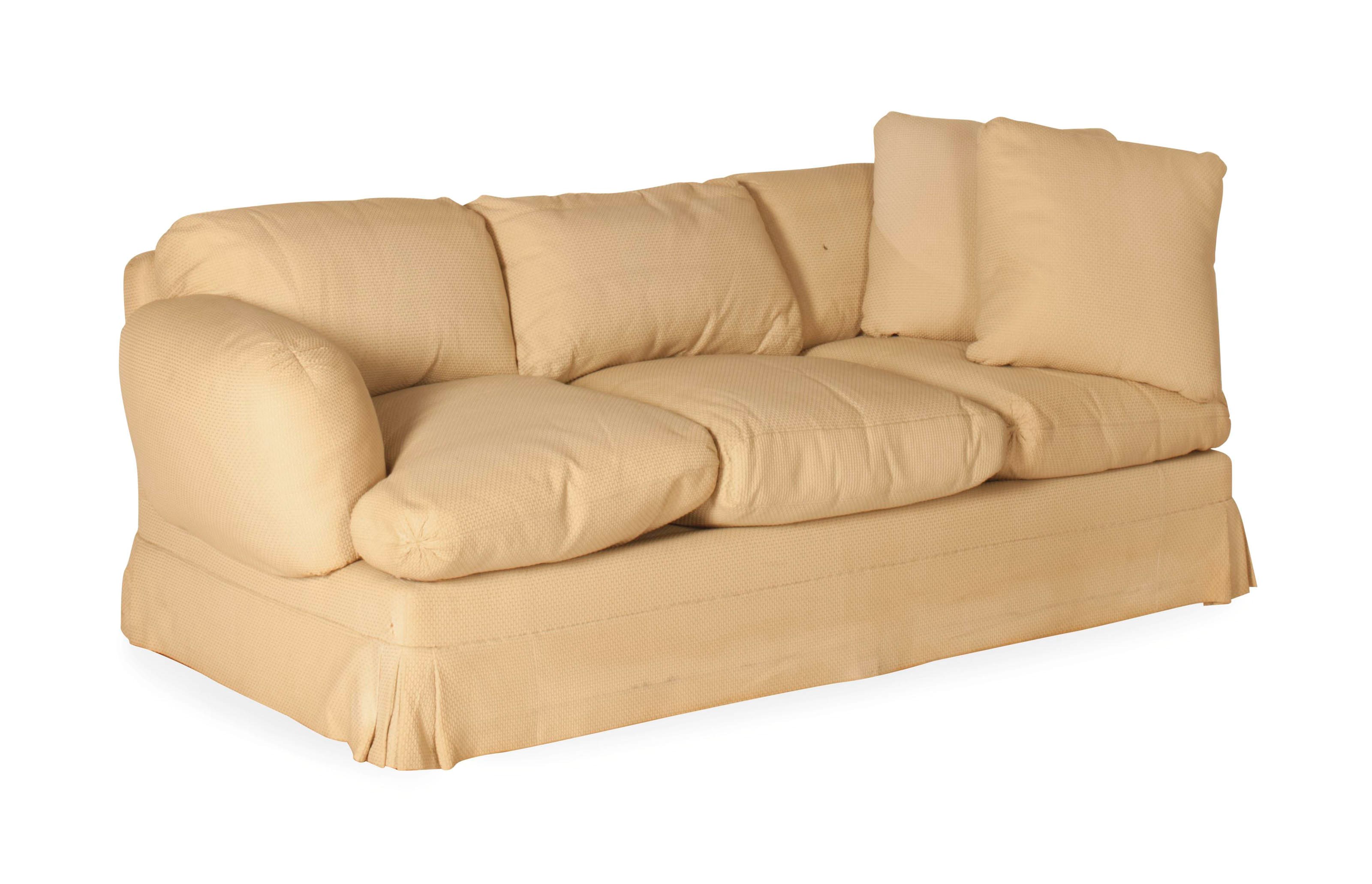 A BEIGE PLUSH-UPHOLSTERED THREE-SEAT SOFA,