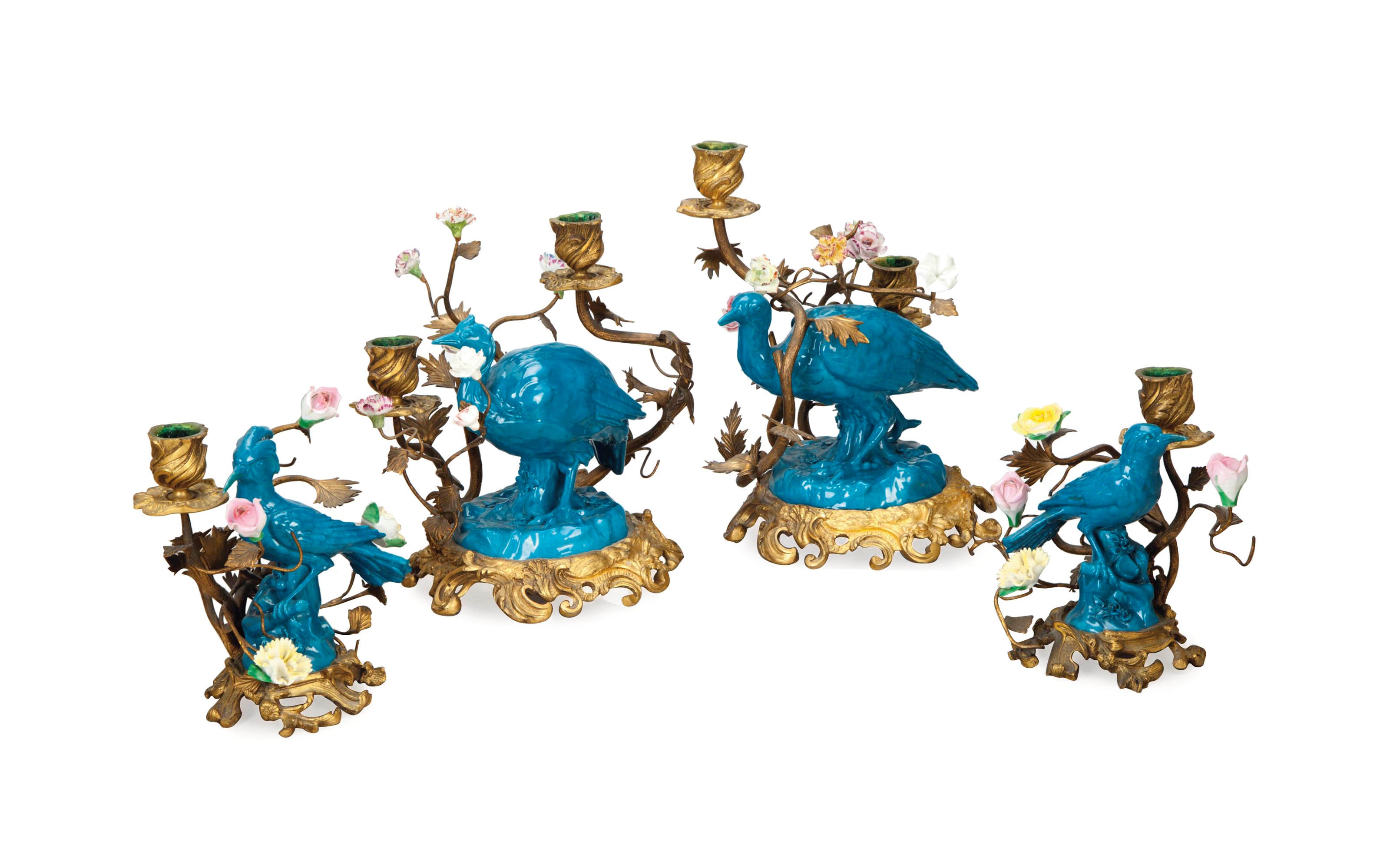 TWO PAIRS OF PORCELAIN-MOUNTED GILT-METAL CANDELABRA,