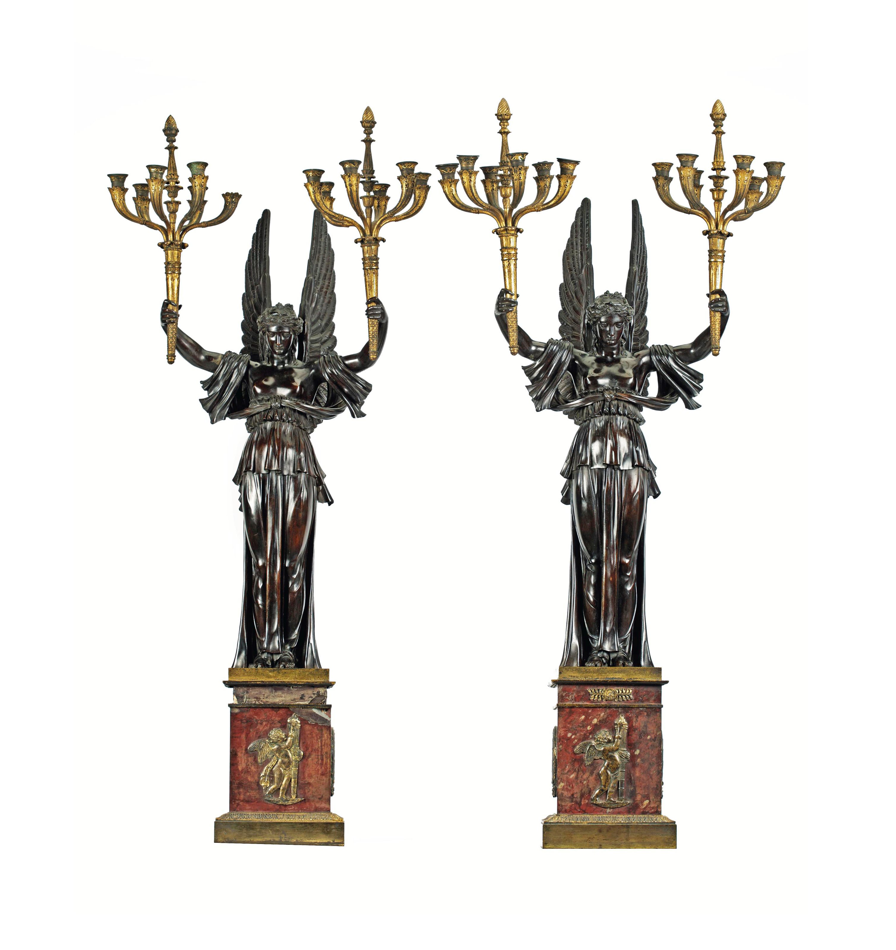 A PAIR OF EMPIRE ORMOLU AND PATINATED BRONZE TWELVE LIGHT CANDELABRA