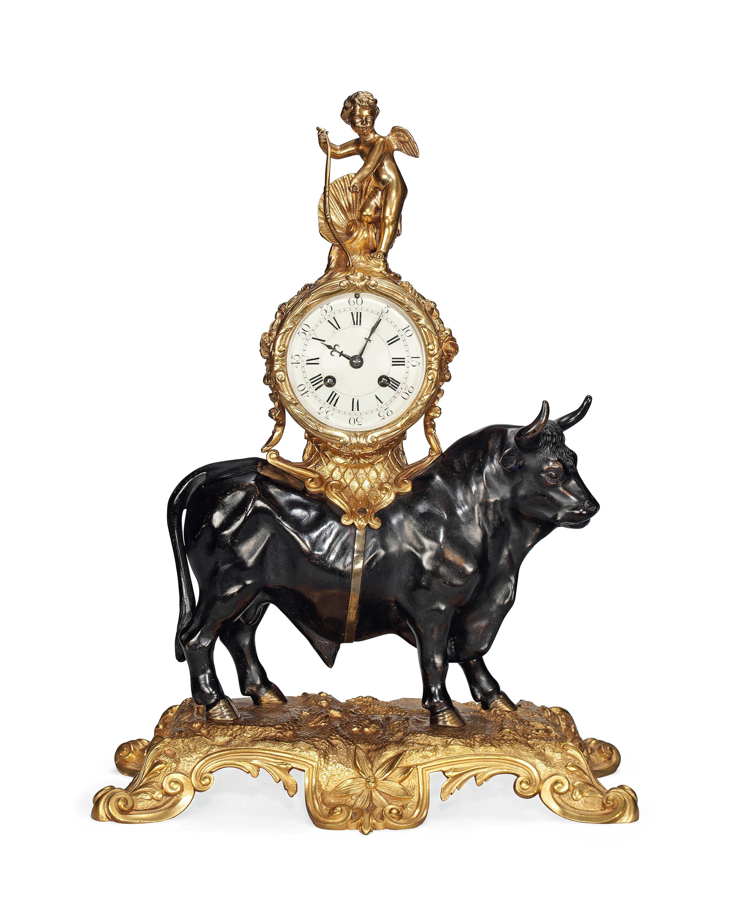 A FRENCH PATINATED AND GILT BRONZE TABLE CLOCK
