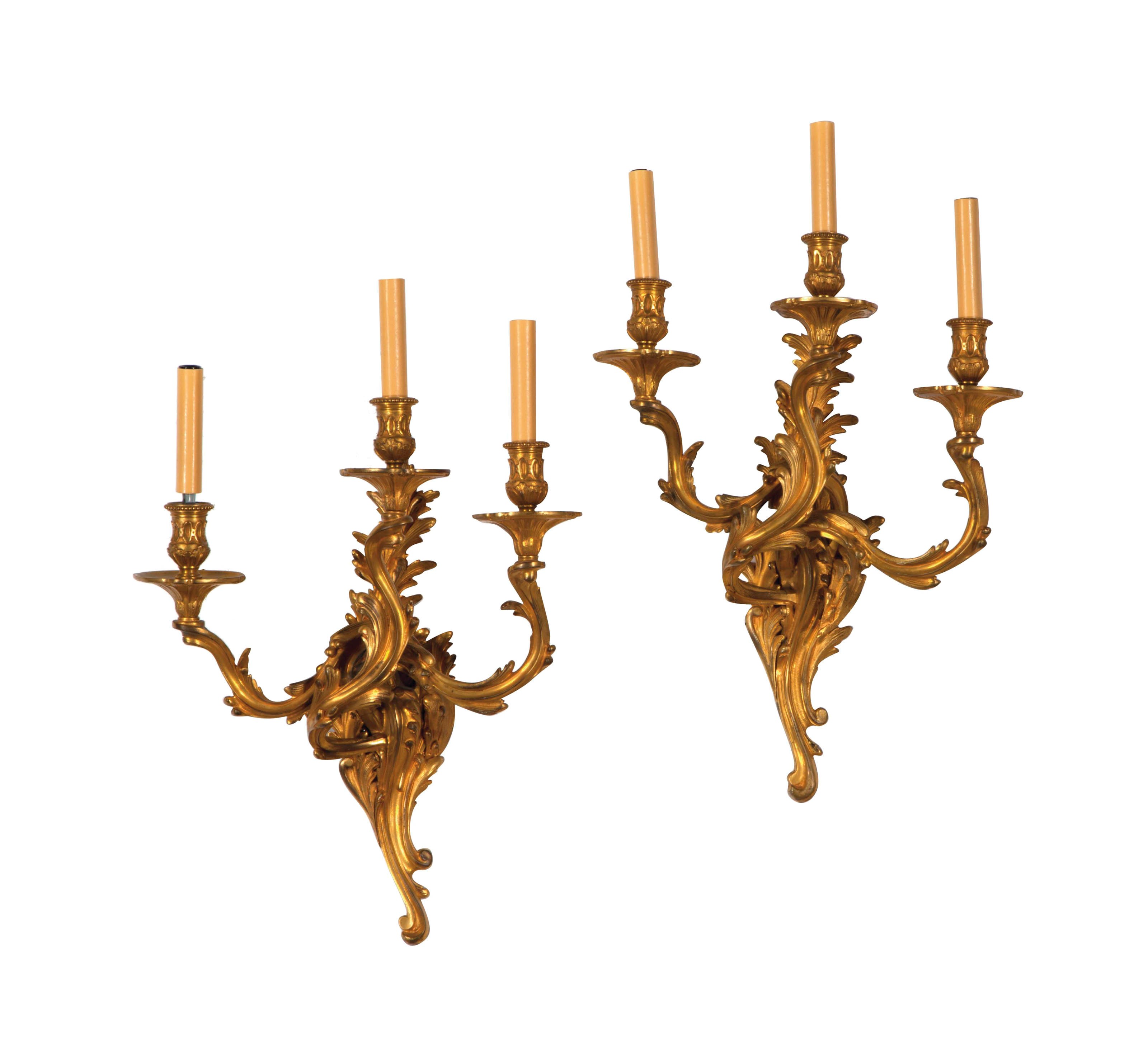 A PAIR OF FRENCH GILT-METAL THREE-BRANCH WALL LIGHTS,