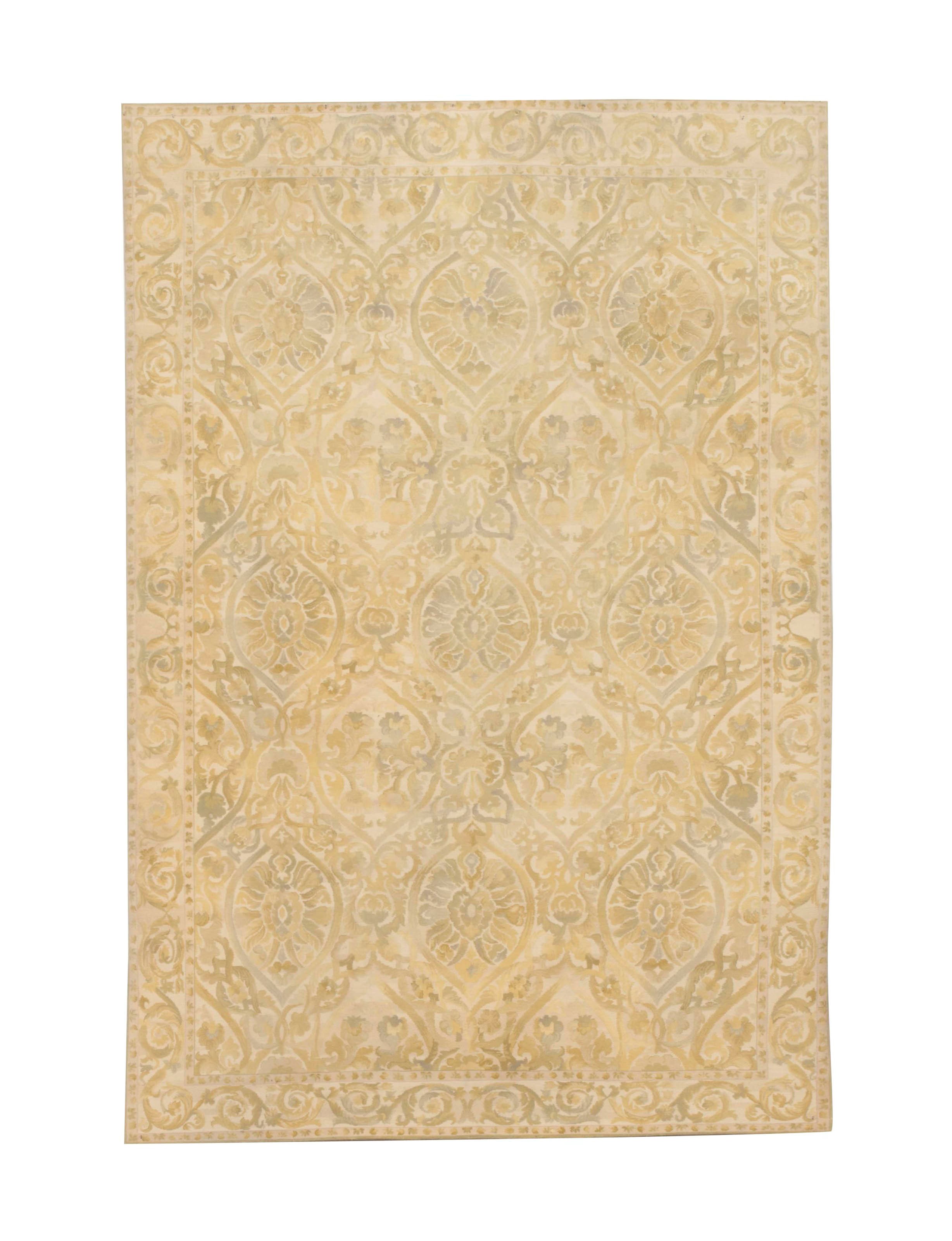 A CREAM AND PALE-GREEN MACHINE WOVEN CARPET,
