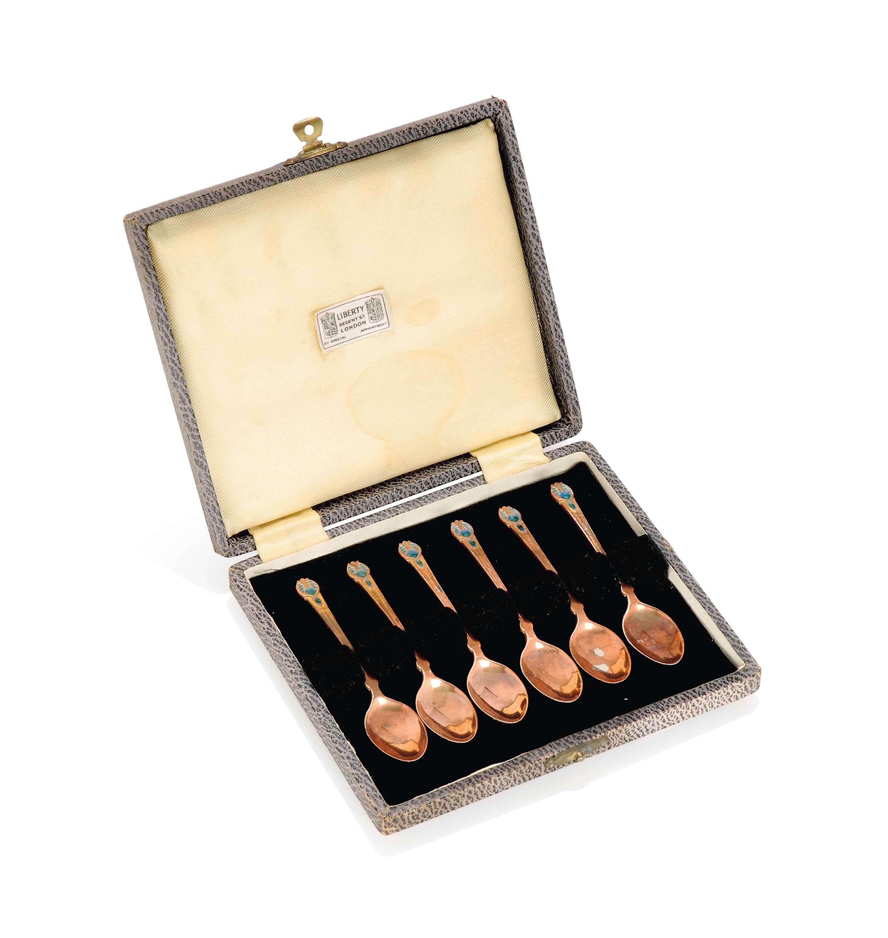 A SET OF LIBERTY & CO COPPER-PLATED SILVER AND ENAMEL COFFEE SPOONS