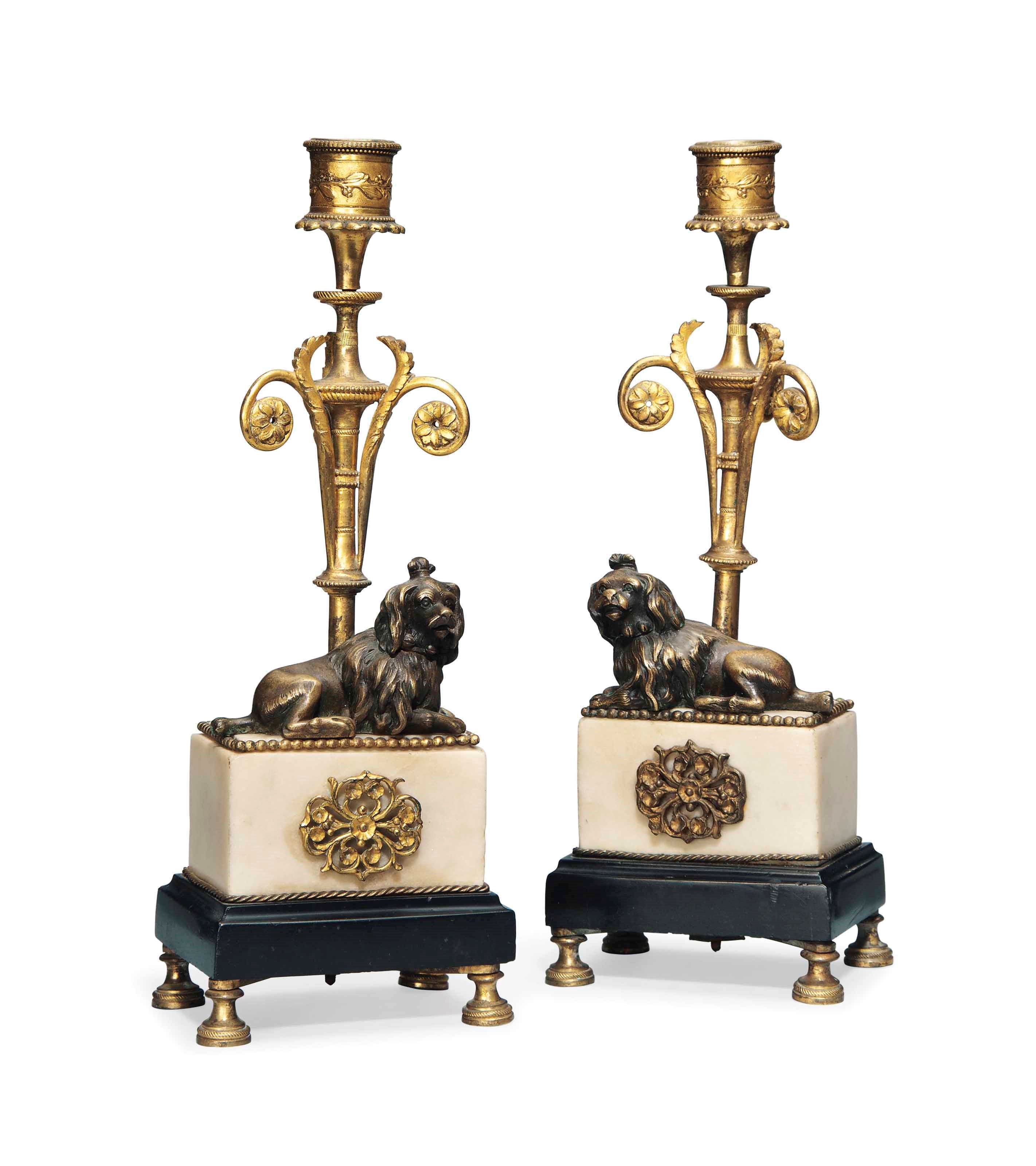 A PAIR OF FRENCH GILT BRONZE AND MARBLE CANDLESTICKS