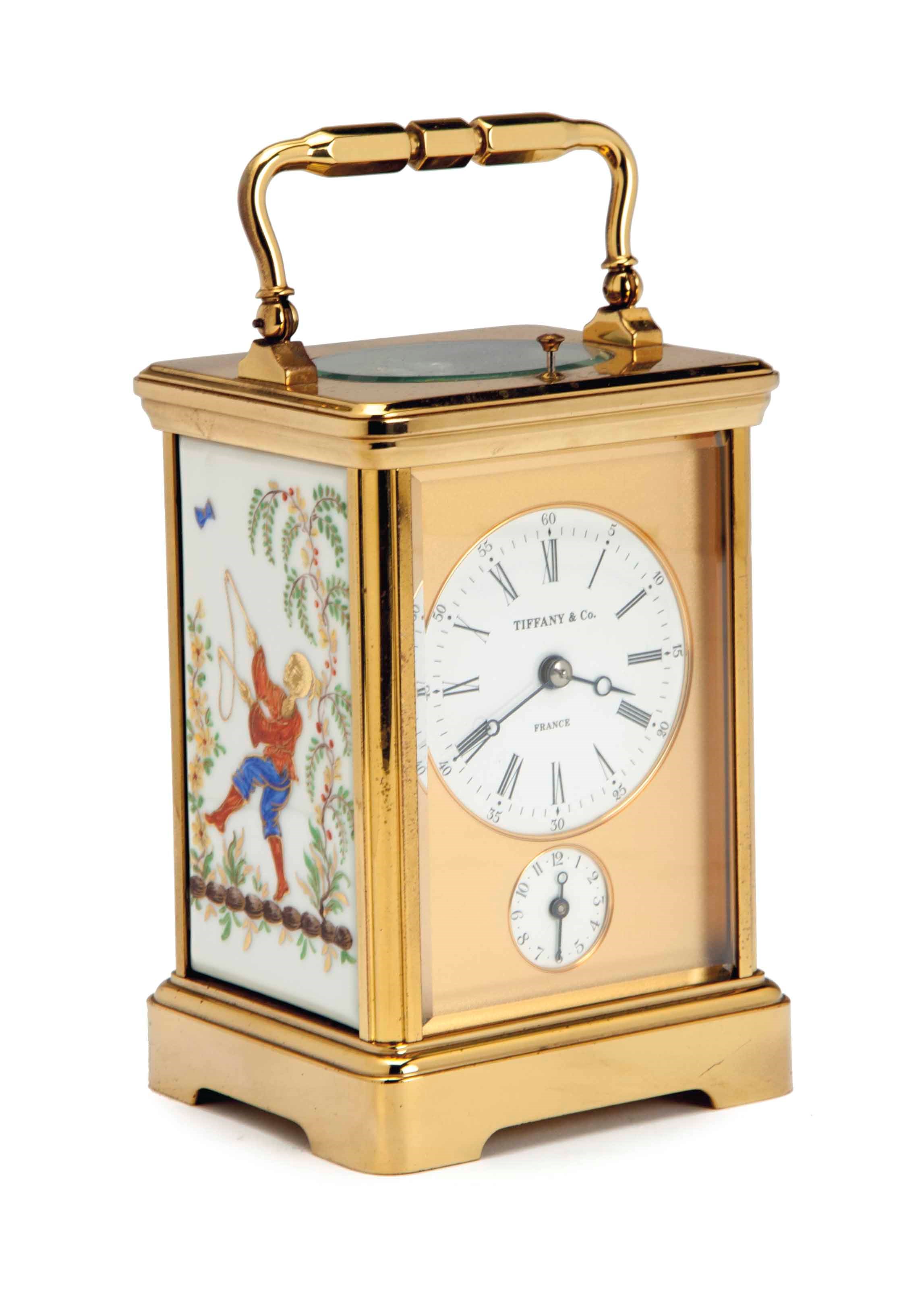 A FRENCH BRASS AND PORCELAIN STRIKE/REPEAT/ALARM CARRIAGE CLOCK BY L'EPEE,