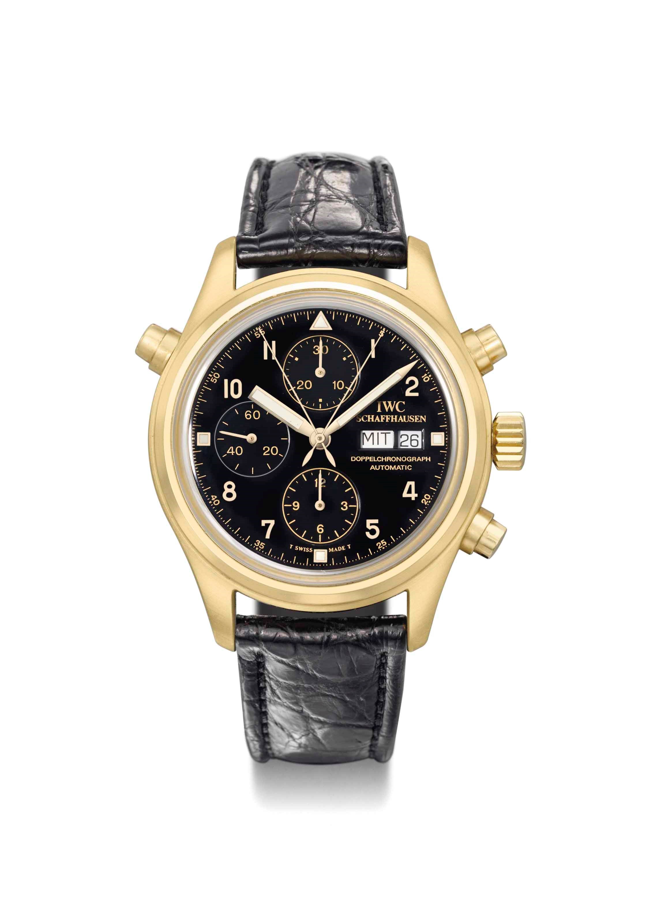 IWC. A 18K gold automatic split seconds pilot's chronograph wristwatch with day and date