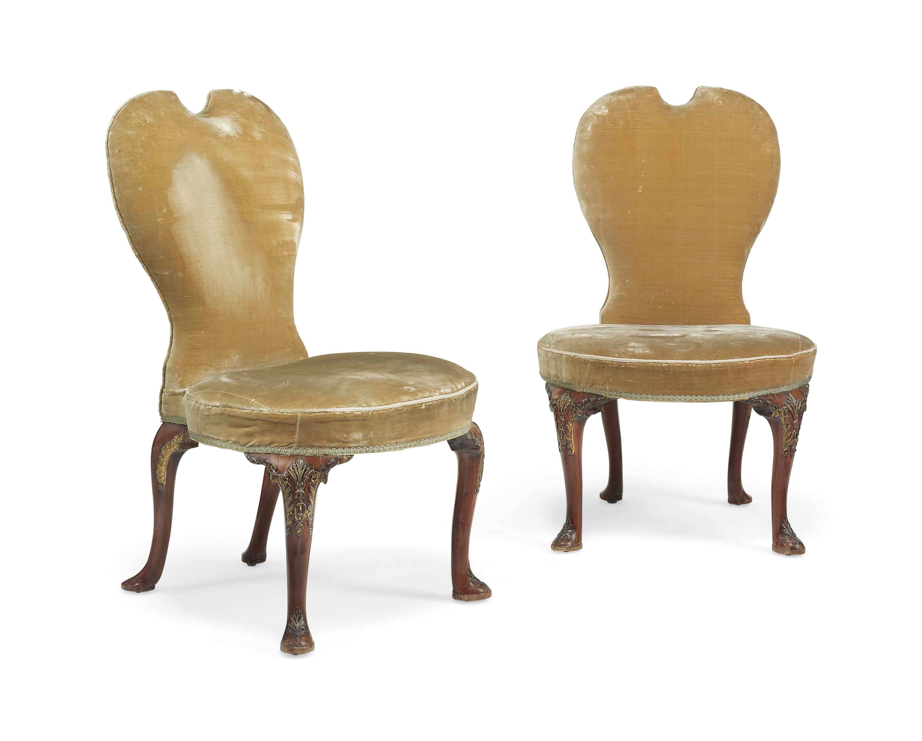 A PAIR OF GEORGE II PARCEL-GILT MAHOGANY CHAIRS