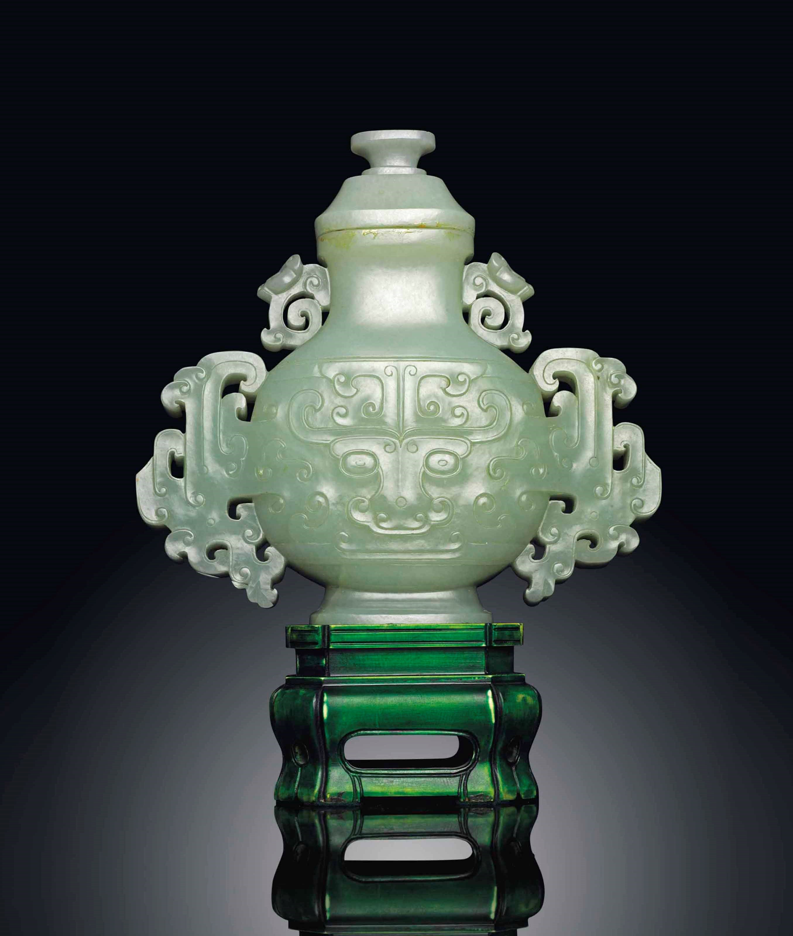 A PALE CELADON JADE ARCHAISTIC VASE AND COVER