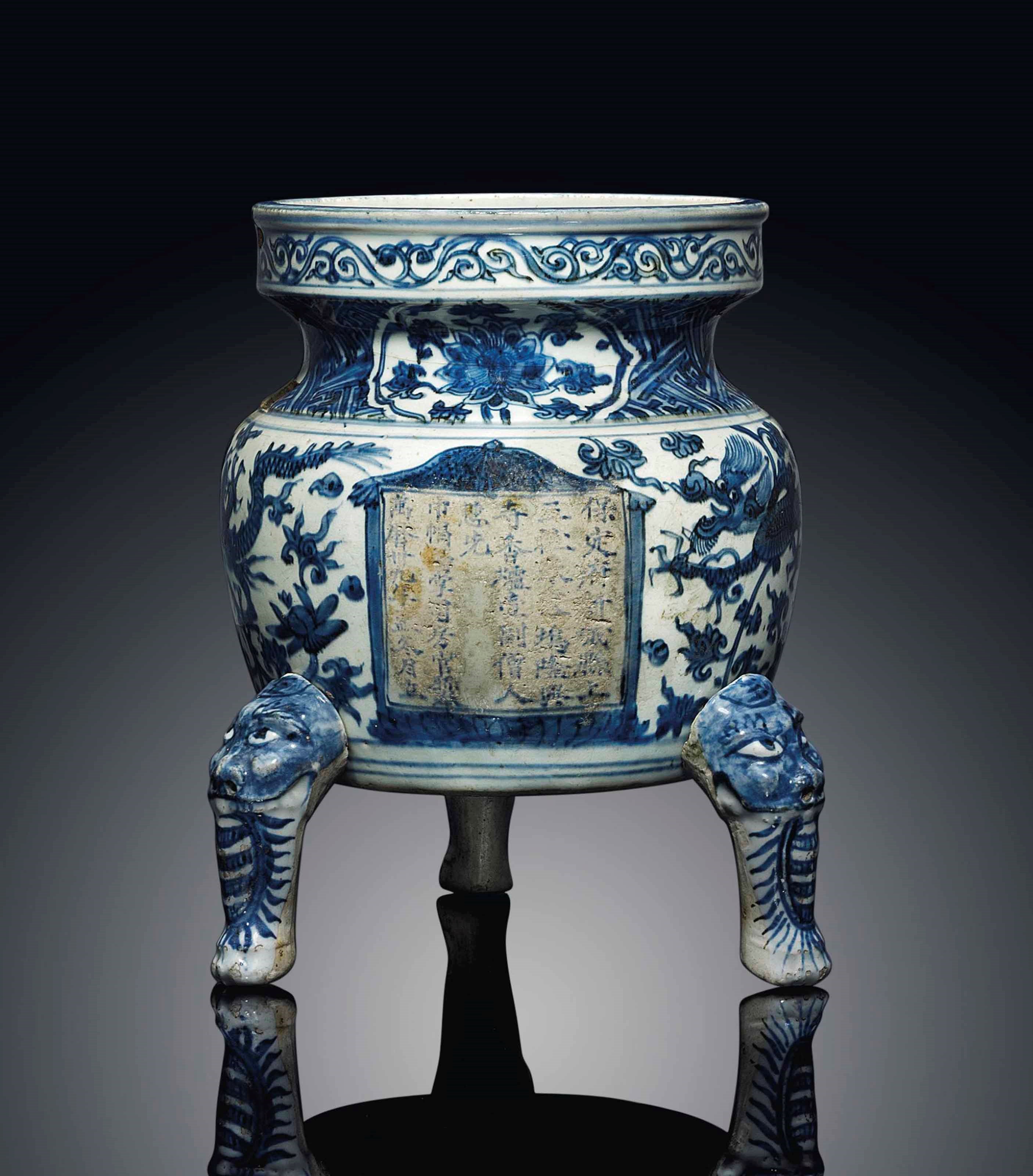 AN INSCRIBED AND DATED BLUE AND WHITE TRIPOD CENSER