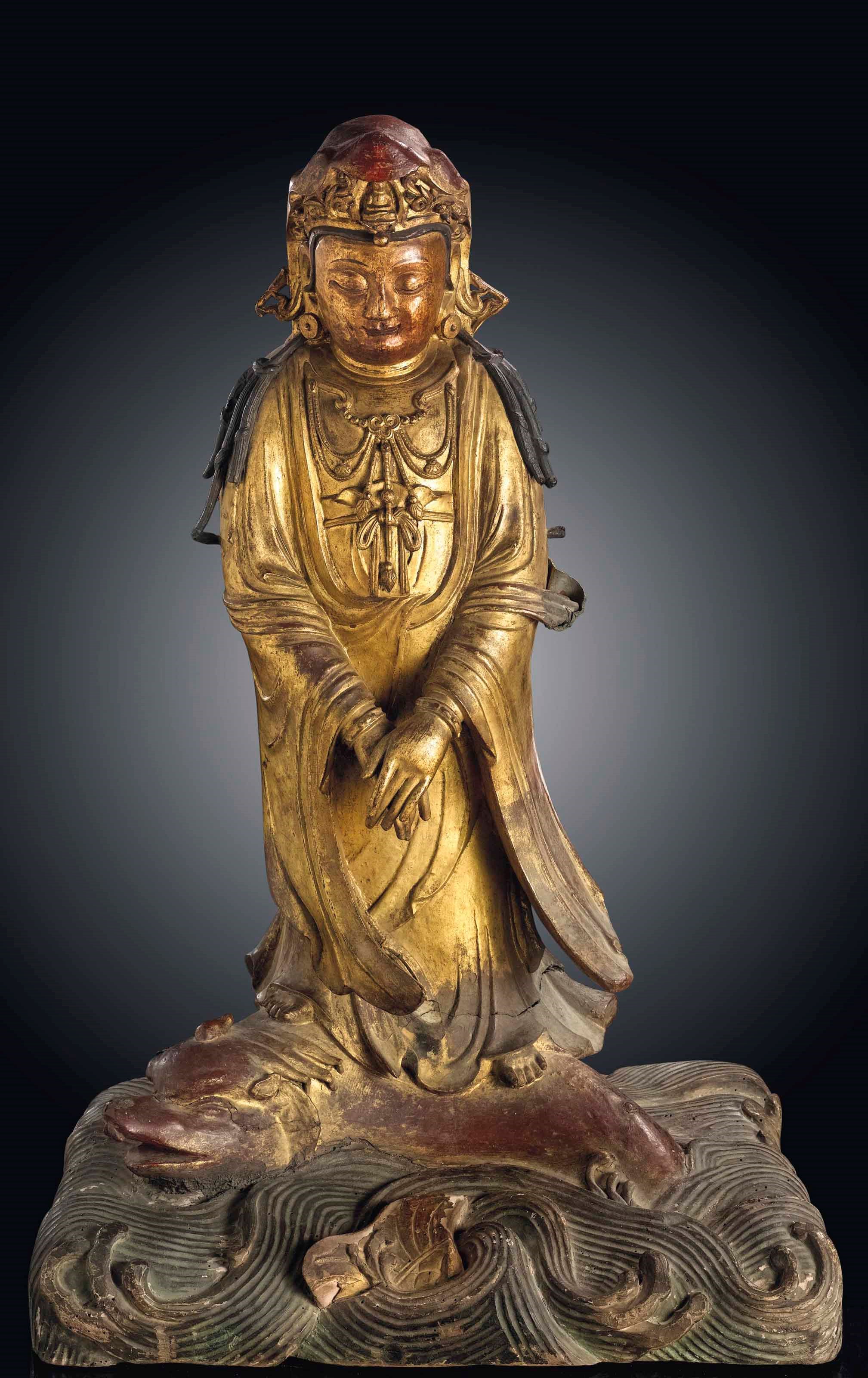 A LARGE GILT-LACQUERED BRONZE FIGURE OF GUANYIN