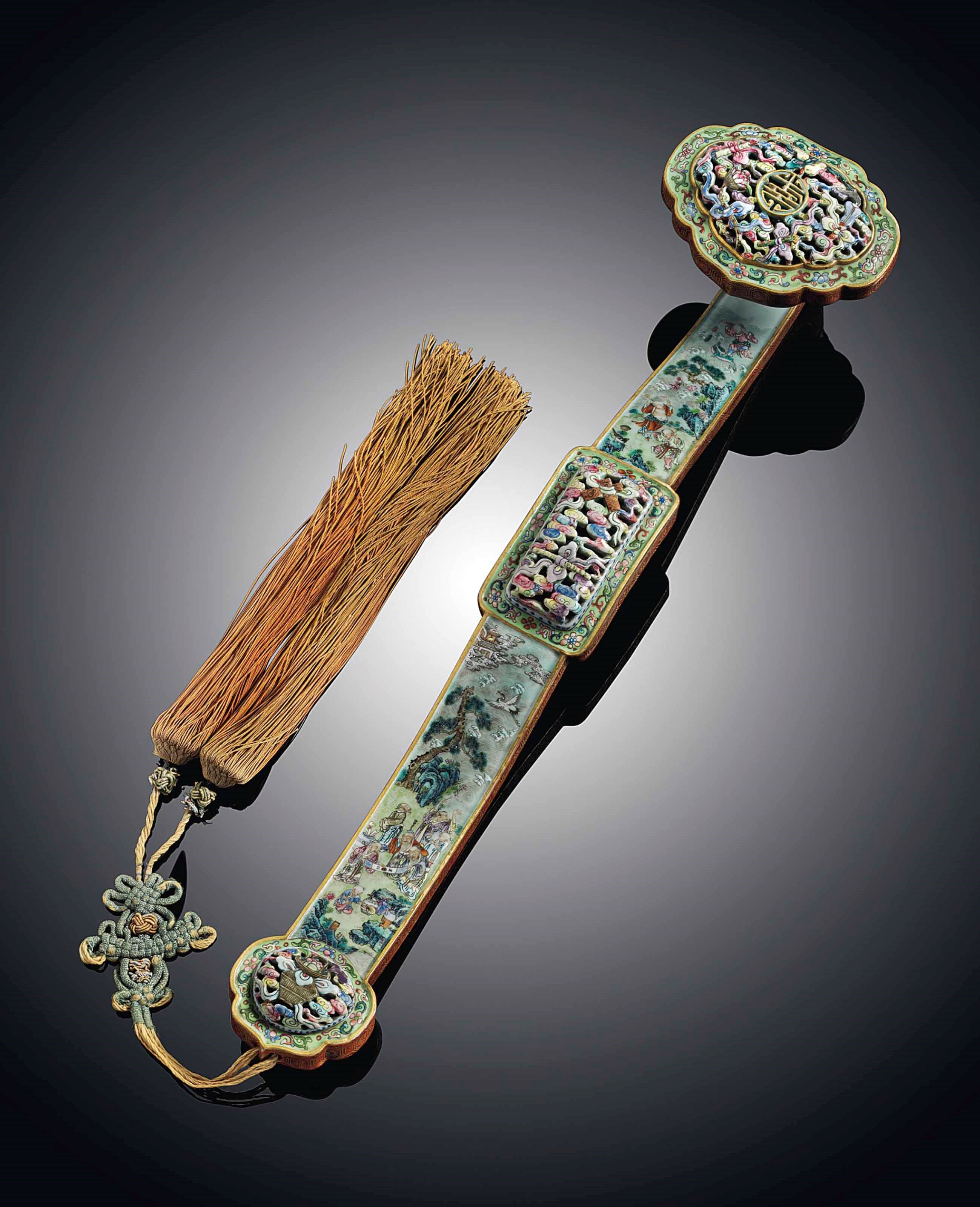 A FAMILLE ROSE MOULDED SCEPTRE, RUYI