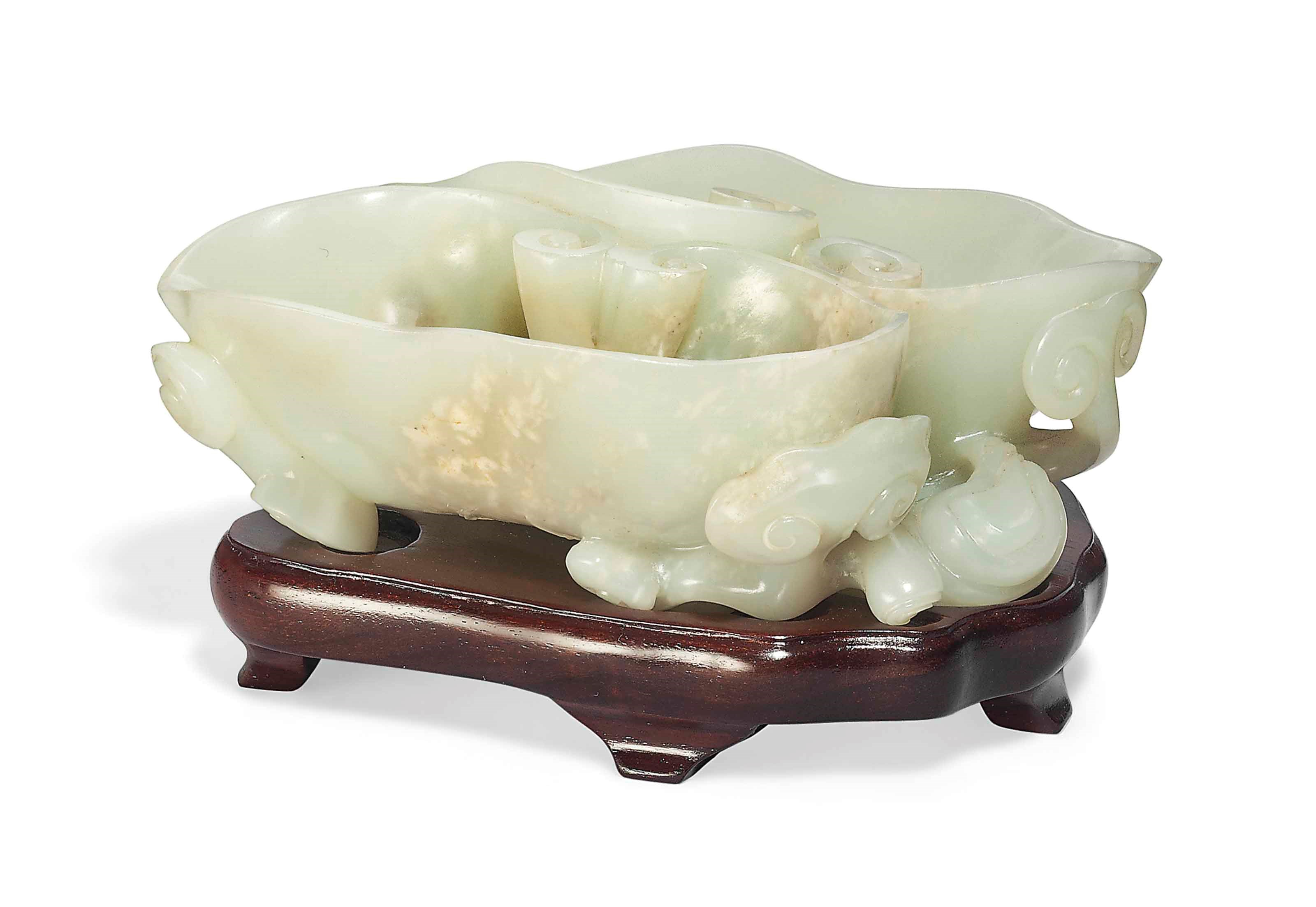 A PALE CELADON JADE 'DOUBLE-RUYI HEAD' BRUSH WASHER