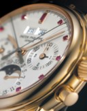 PATEK PHILIPPE. A VERY RARE 18K PINK GOLD PERPETUAL CALENDAR SPLIT SECONDS CHRONOGRAPH WRISTWATCH WITH UNUSUAL RUBY-SET DIAL, MOON PHASES, 24 HOUR AND LEAP YEAR INDICATION, ORIGINAL CERTIFICATE AND ADDITIONAL CASE BACK