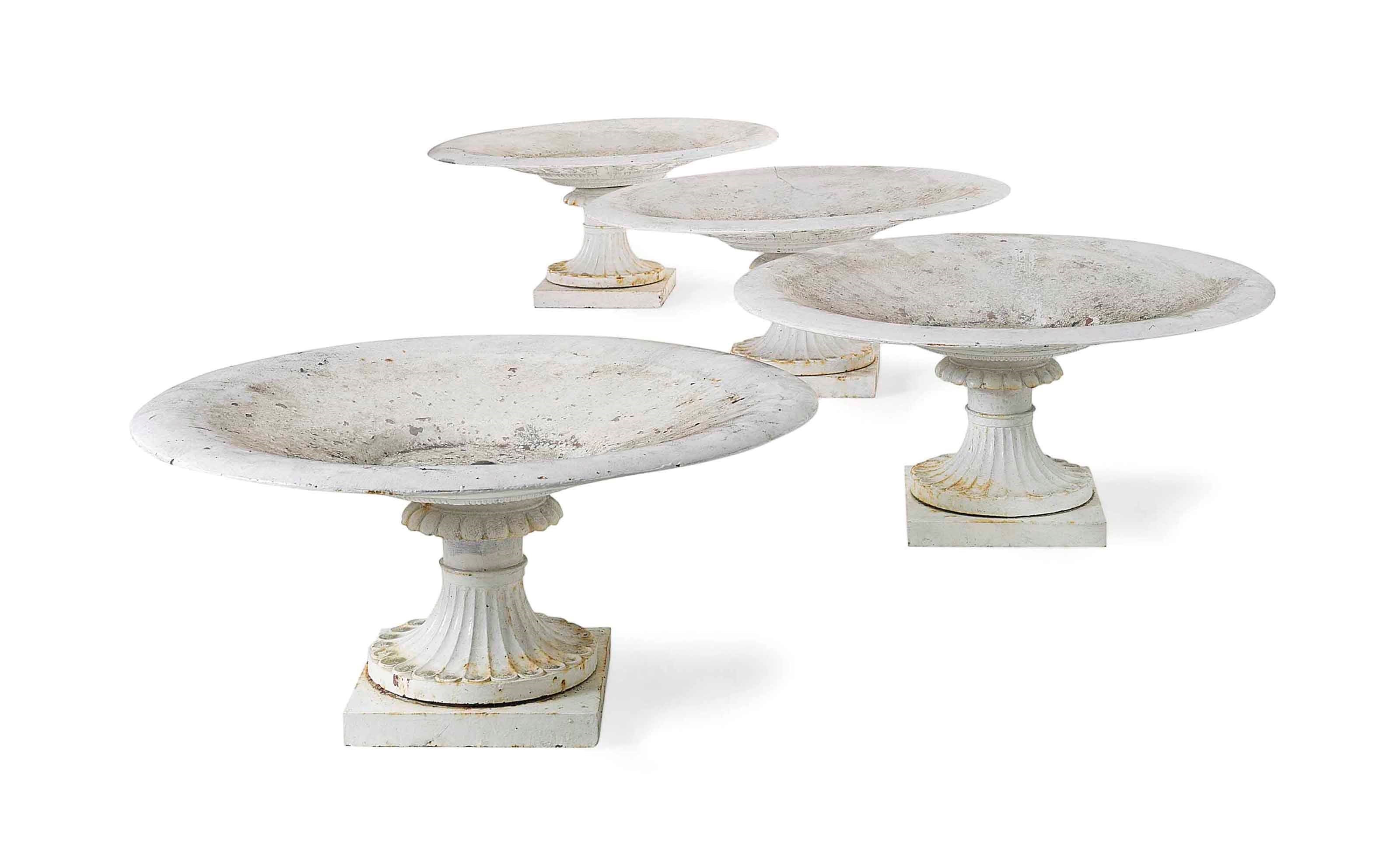 A SET OF FOUR EDWARDIAN WHITE-PAINTED CAST-IRON TAZZA