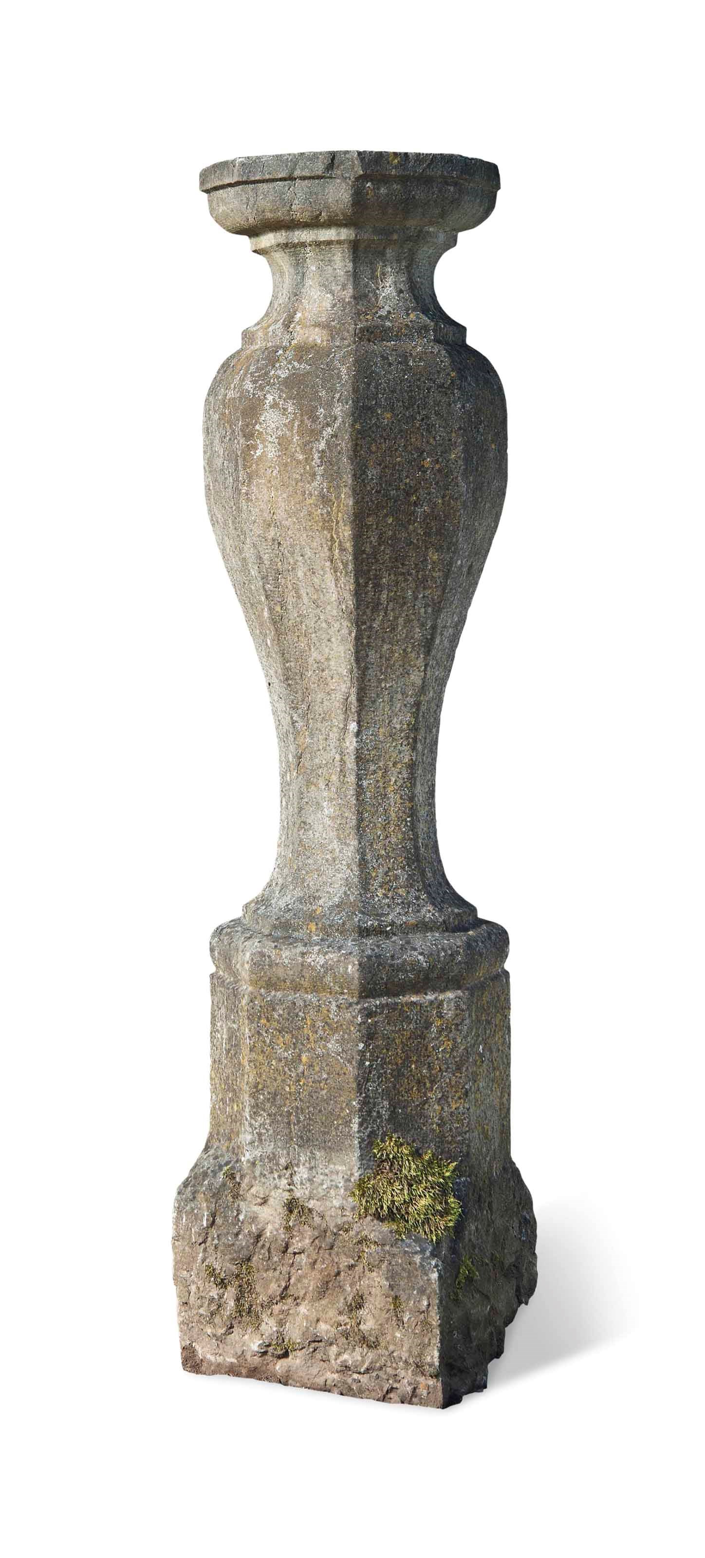 A GRITSTONE OCTAGONAL SUNDIAL PEDESTAL