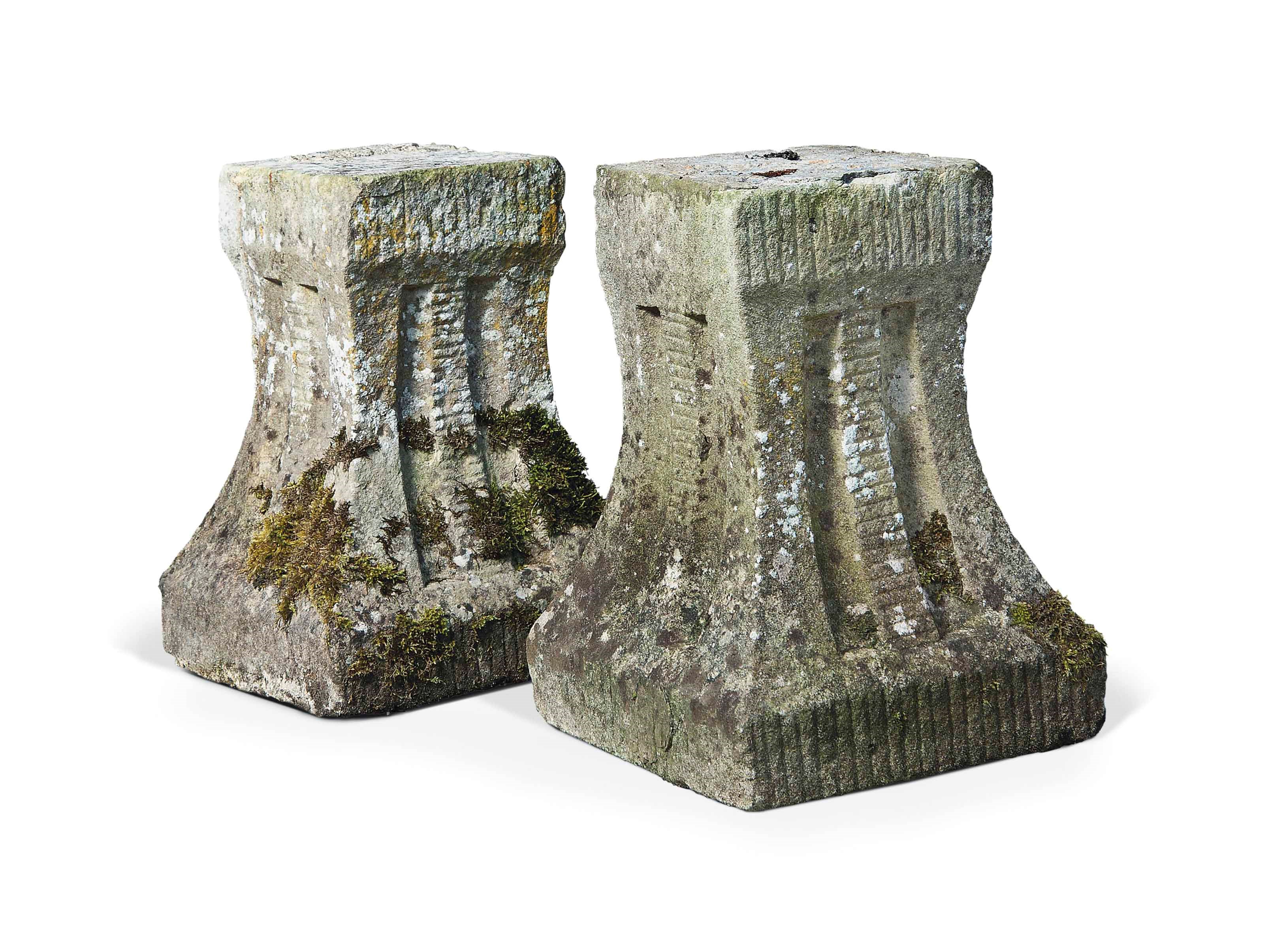 A PAIR OF CARVED STONE LOW SQUARE PEDESTALS