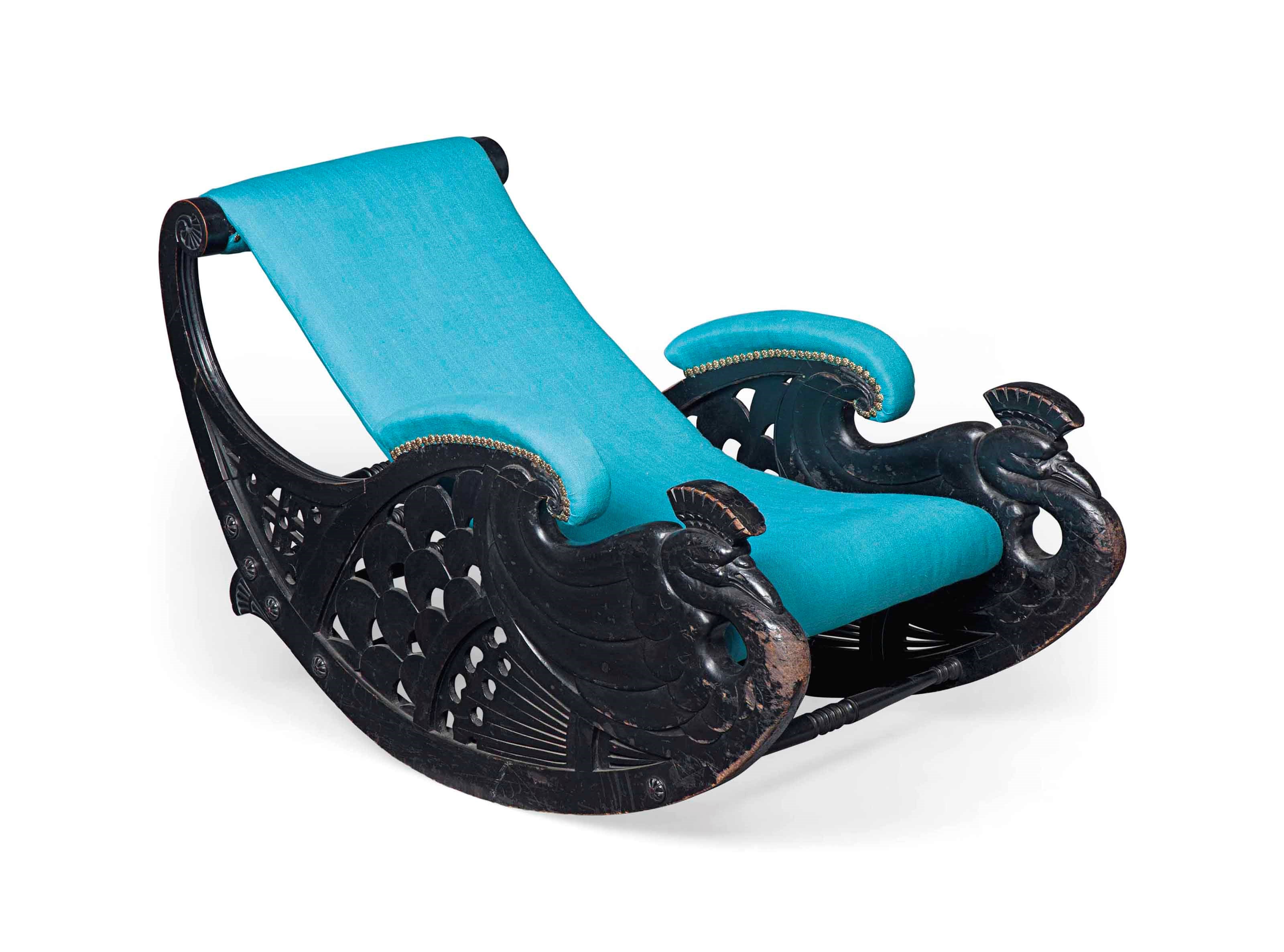 AN UNUSUAL AESTHETIC MOVEMENT EBONISED WOOD 'PEACOCK' ROCKING CHAIR