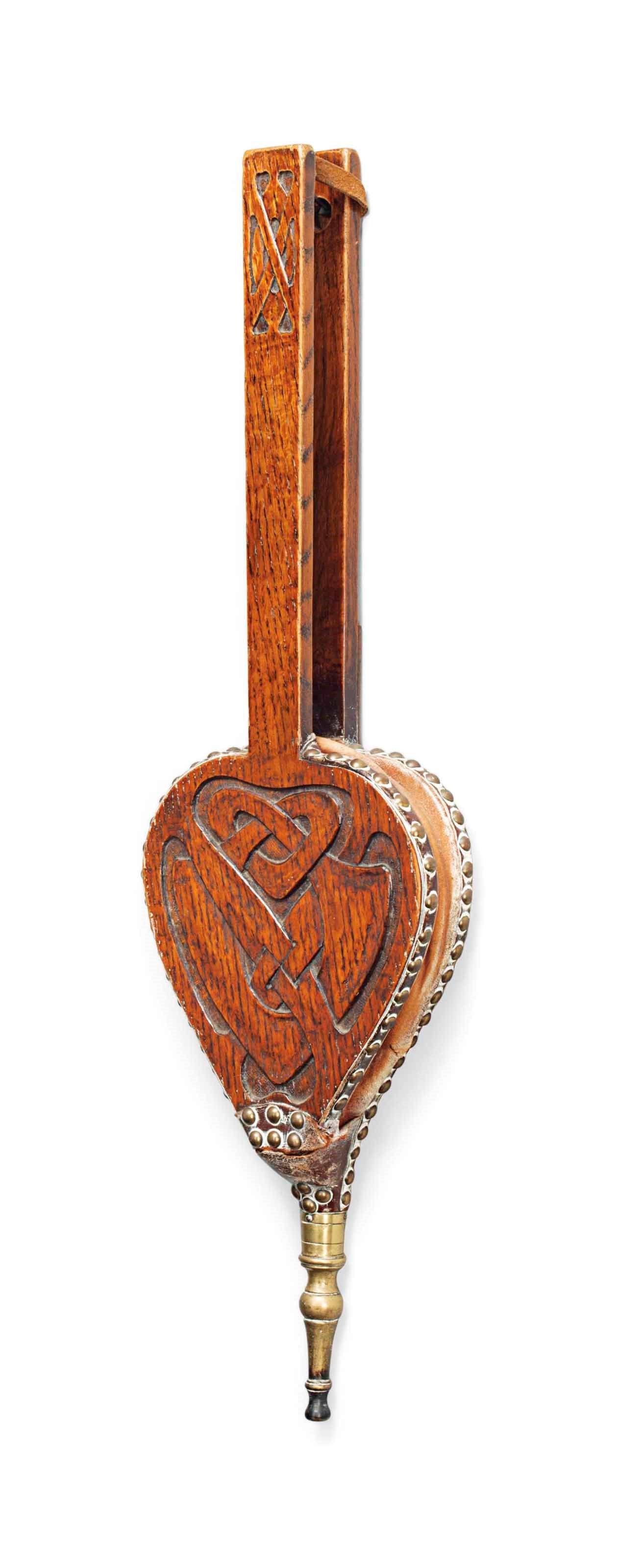 A PAIR OF ARCHIBALD KNOX  (1864-1933) OAK, LEATHER AND BRASS BELLOWS