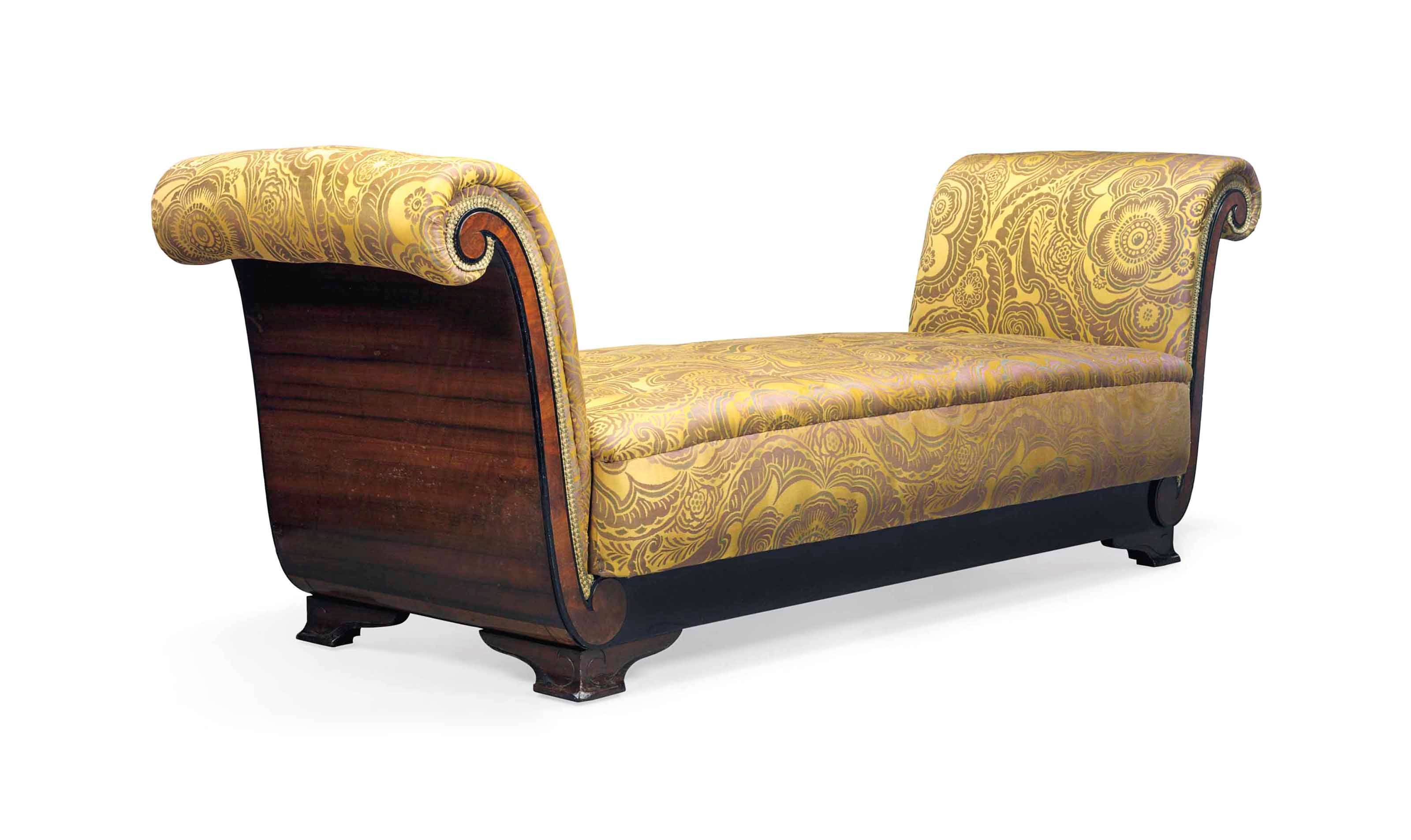 AN ART DECO WALNUT VENEERED EBONISED AND UPHOLSTERED DAYBED DESIGNED BY CHARLES CAMERON BAILLIE