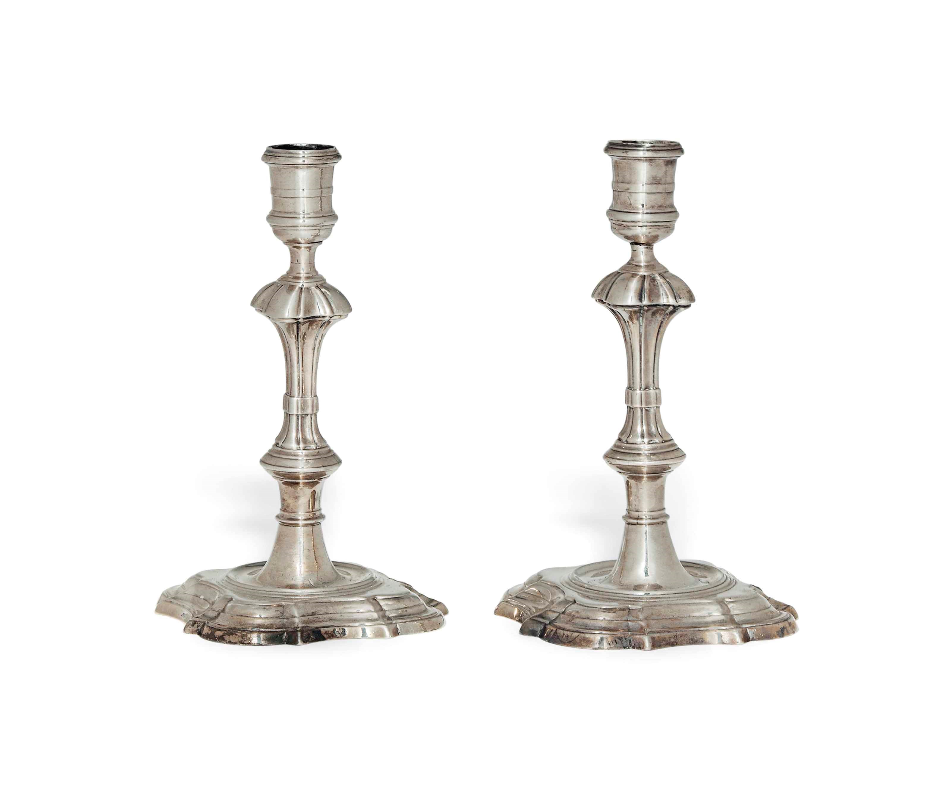 A PAIR OF GEORGE II IRISH CAST SILVER CANDLESTICKS