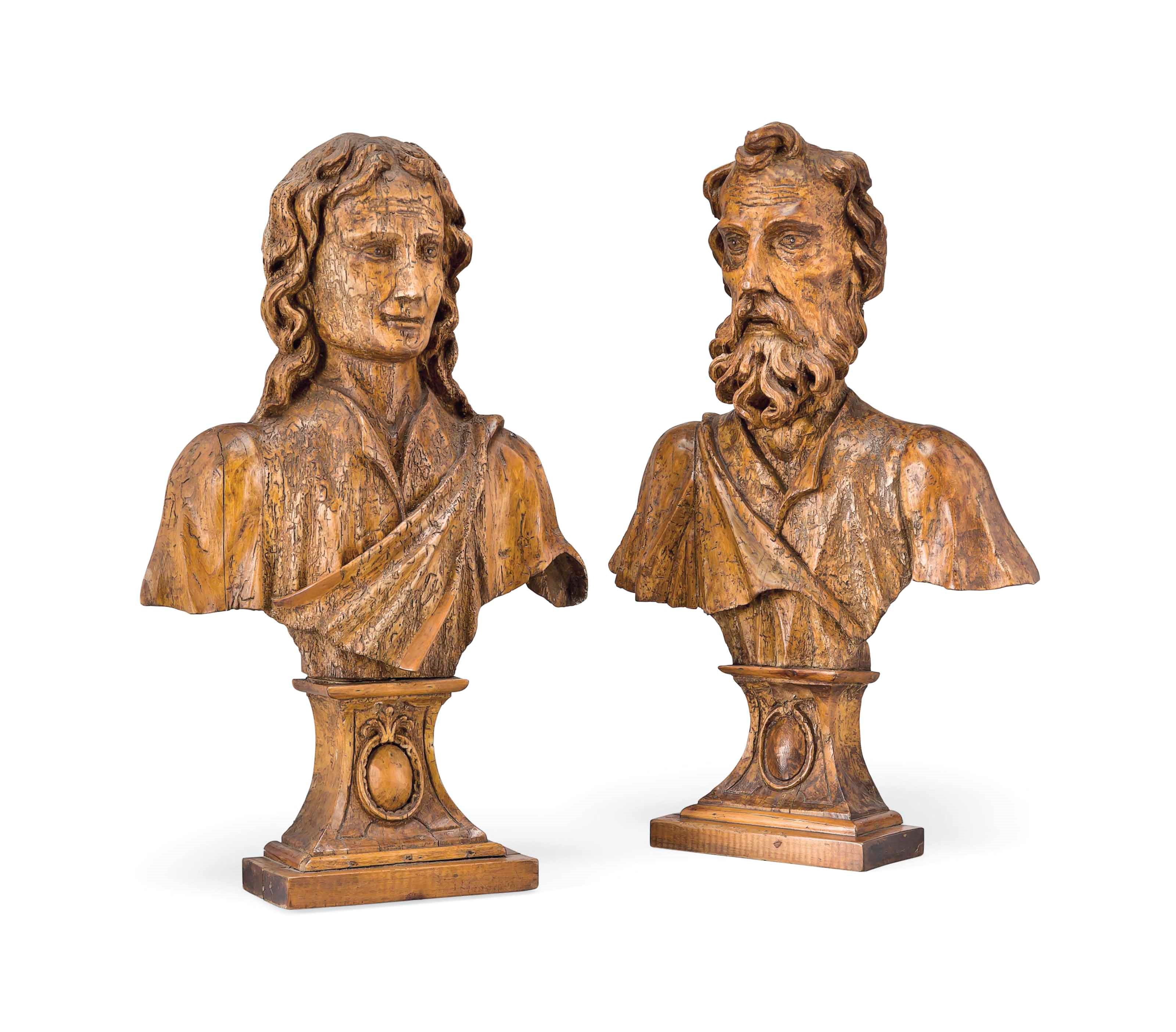 A PAIR OF ITALIAN CARVED WOOD RELIEF BUSTS OF MEN