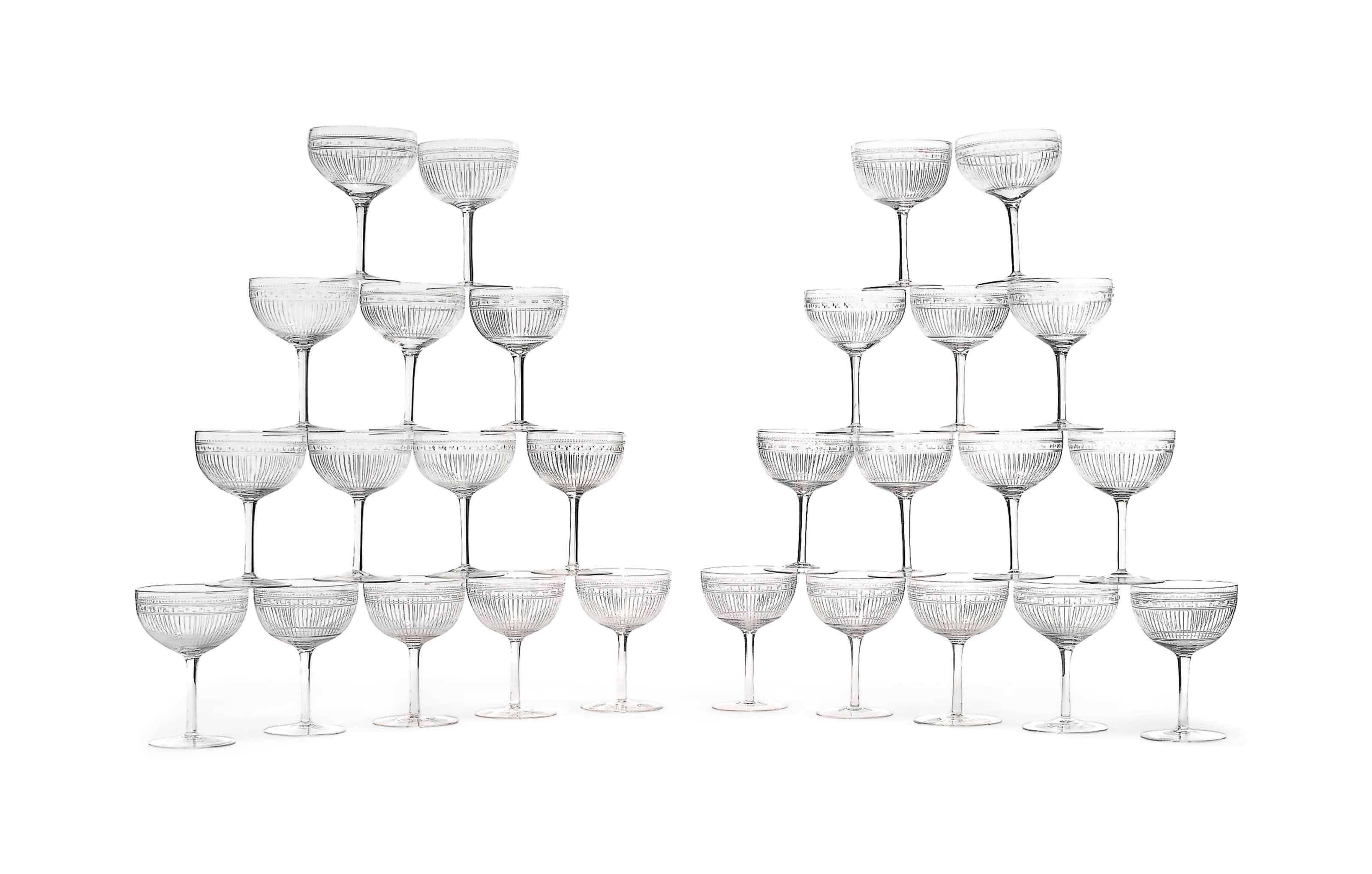 TWENTY-EIGHT ETCHED GLASS CHAMPAGNE COUPES