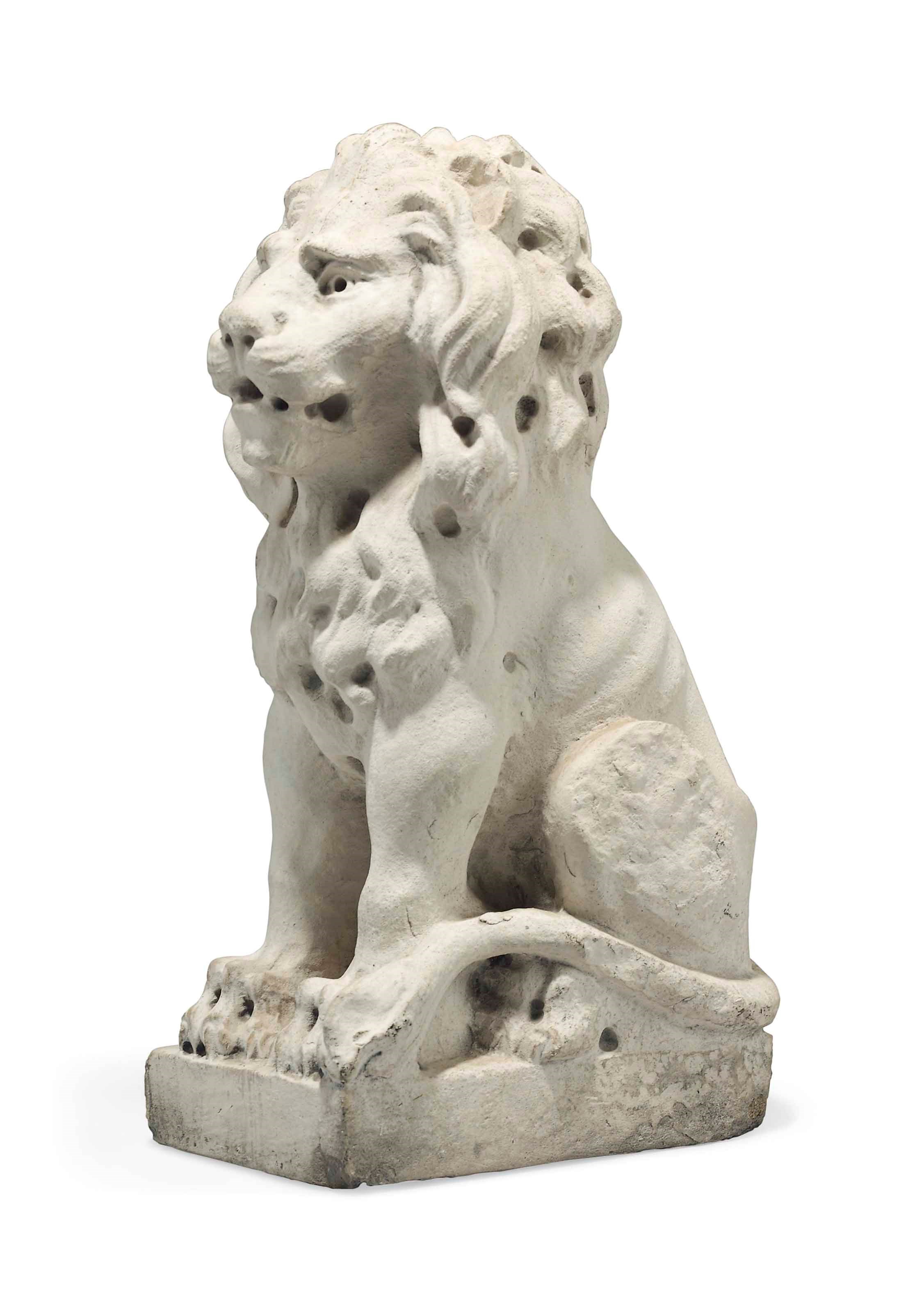 AN ENGLISH WHITE-PAINTED STONE MODEL OF A SEATED LION