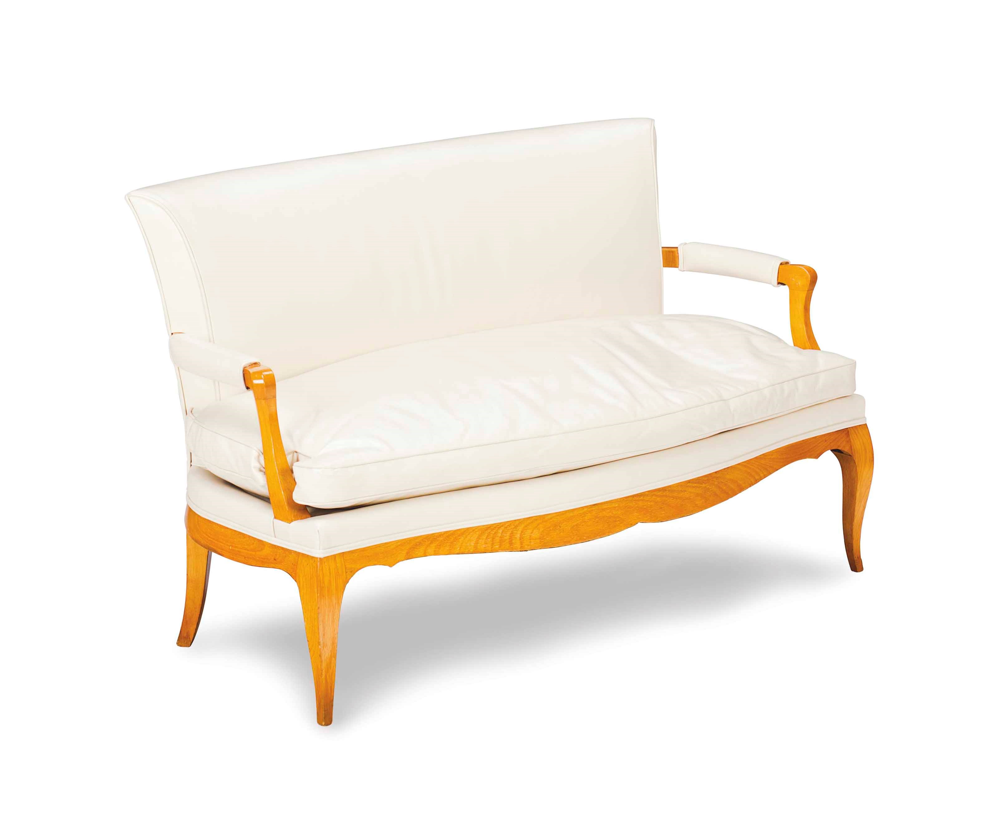 A BIRCH CREAM LEATHER-UPHOLSTERED SOFA,