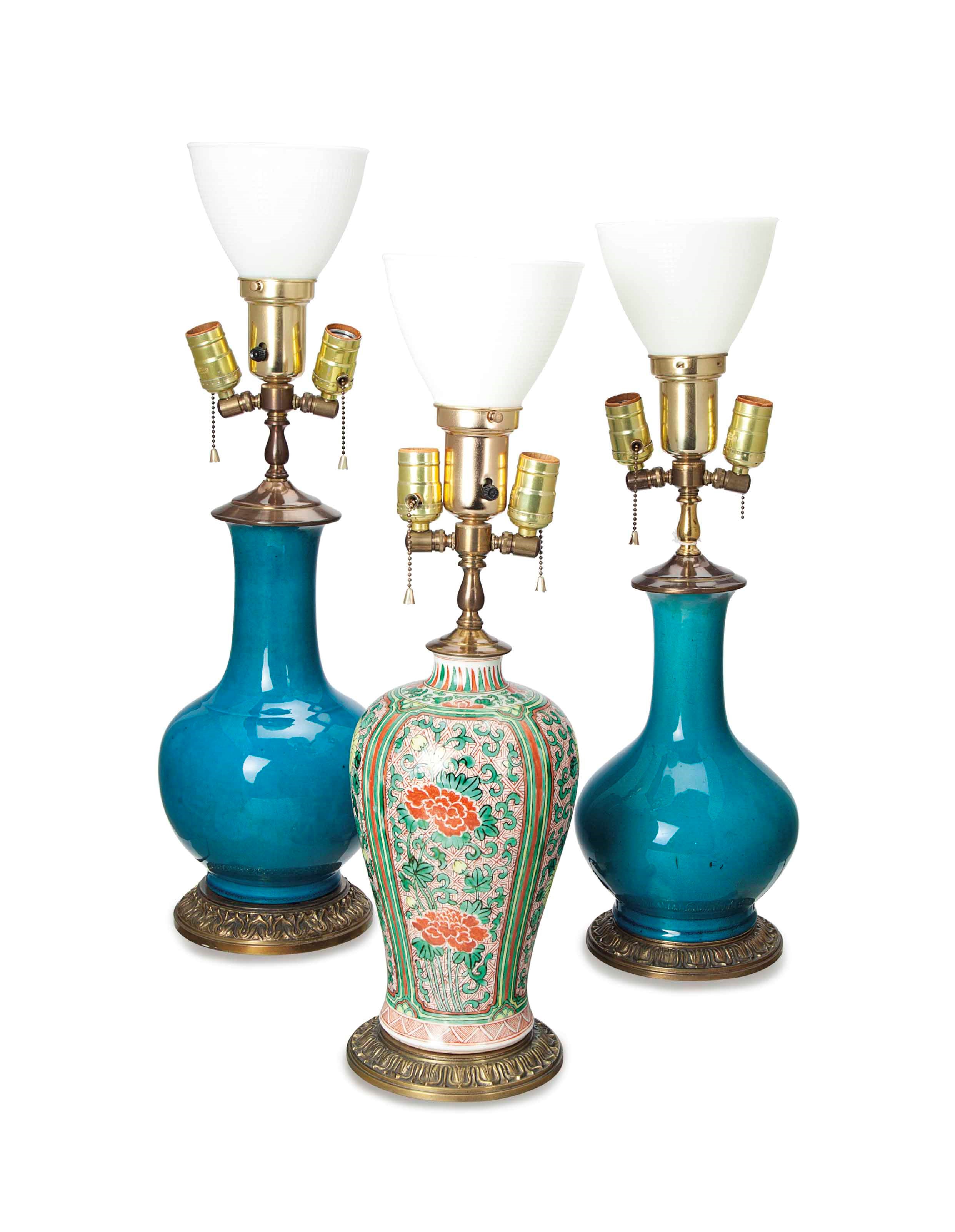 TWO CHINESE TURQUOISE-GLAZED BOTTLE VASES, AND A PAIR OF FAMILLE VERTE VASES, ALL FOUR MOUNTED AS LAMPS,