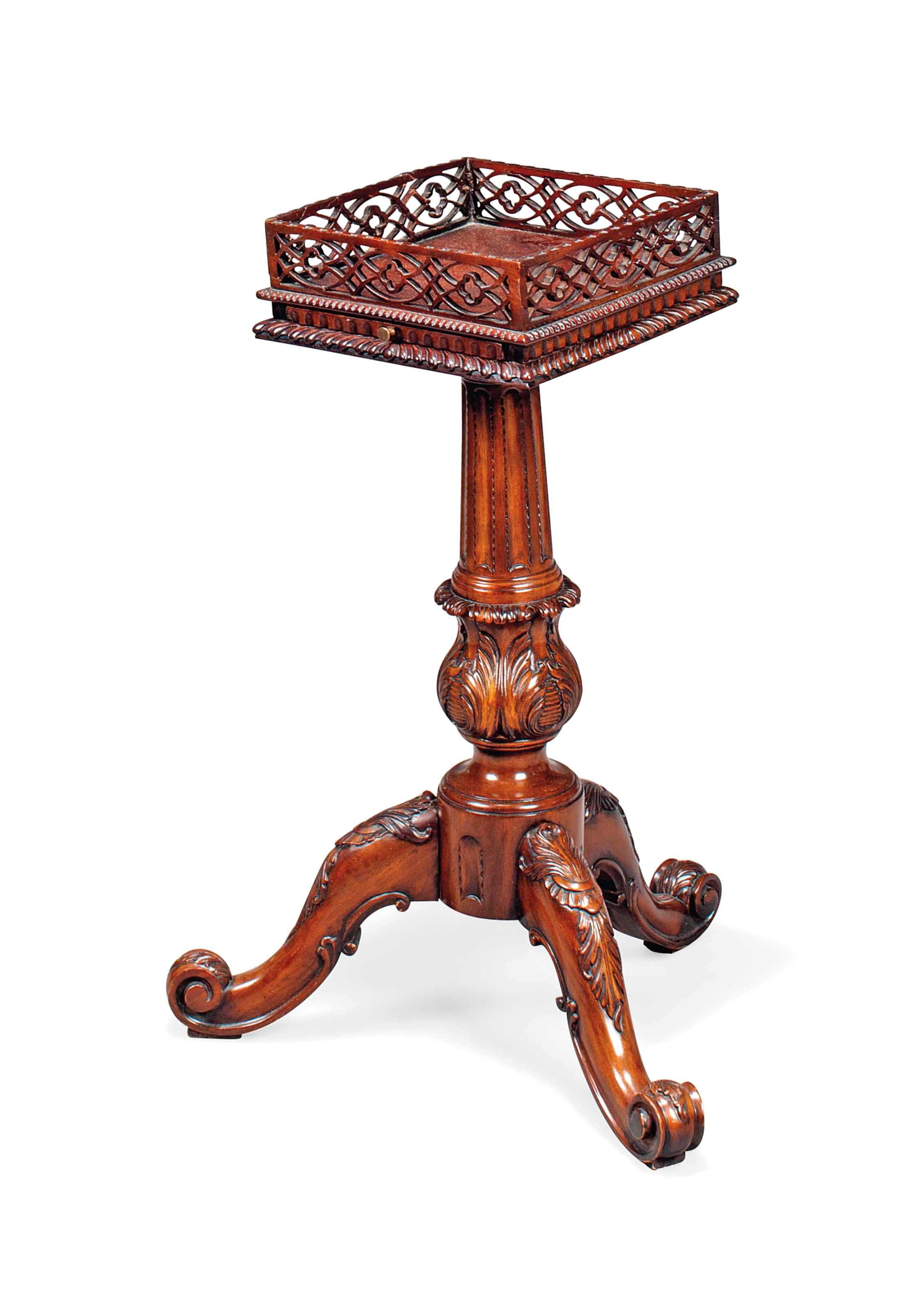 A MAHOGANY URN STAND