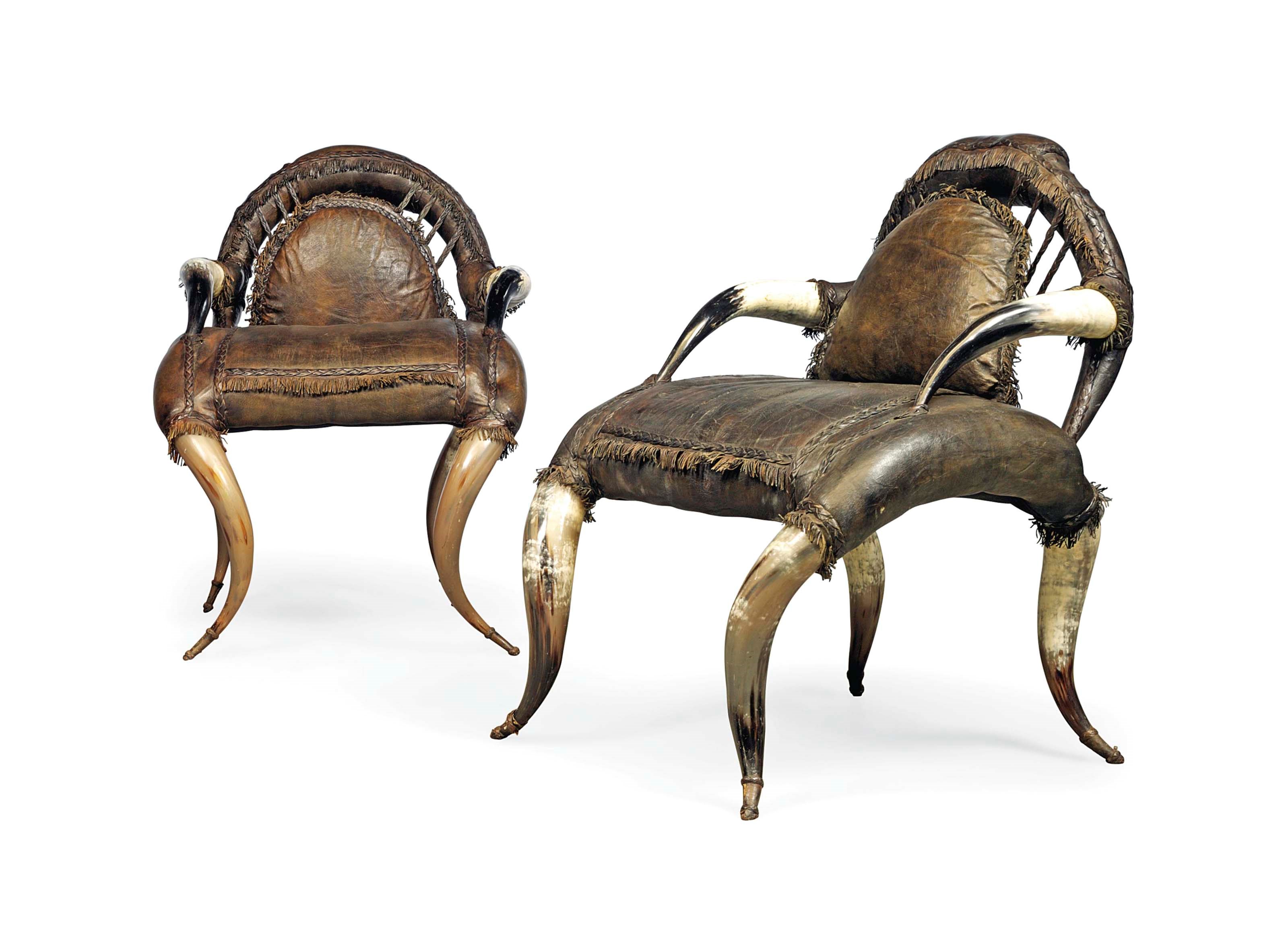 A PAIR BUFFALO HORN AND BROWN LEATHER ARMCHAIRS