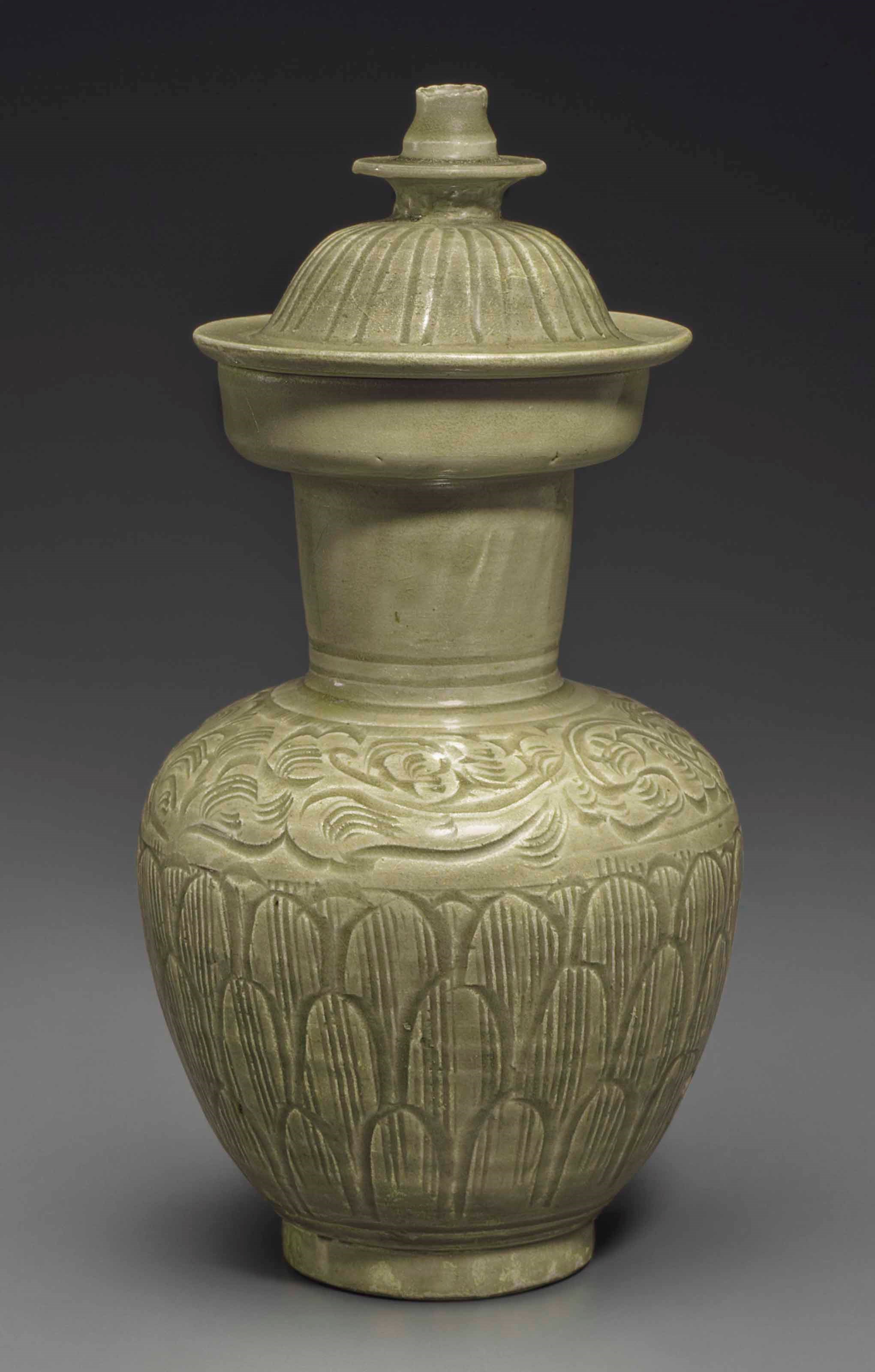A LONGQUAN CELADON CARVED JAR AND COVER