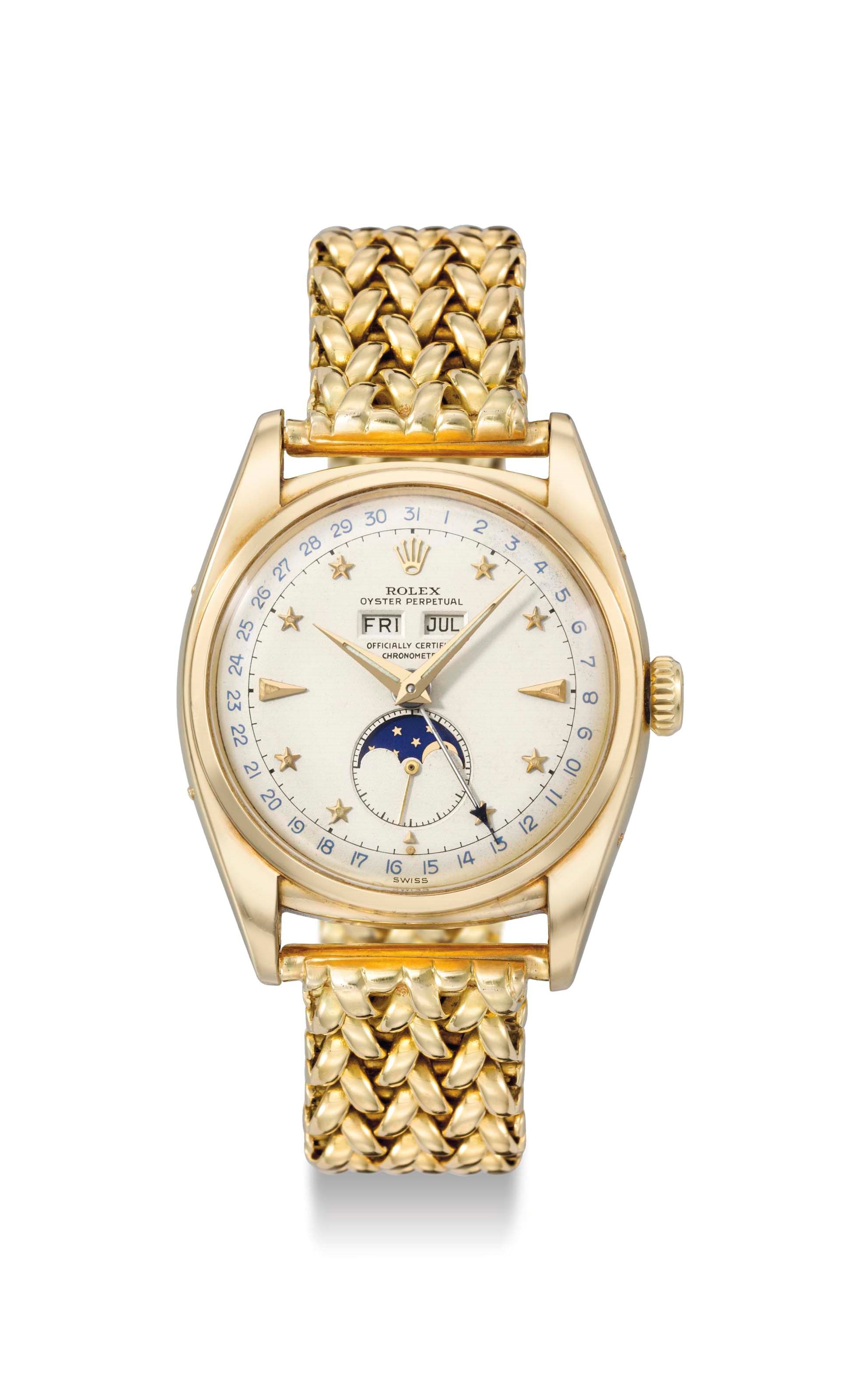 Rolex. A very rare, attractive and important 18K gold automatic triple calendar wristwatch with moon phases, bracelet and star dial